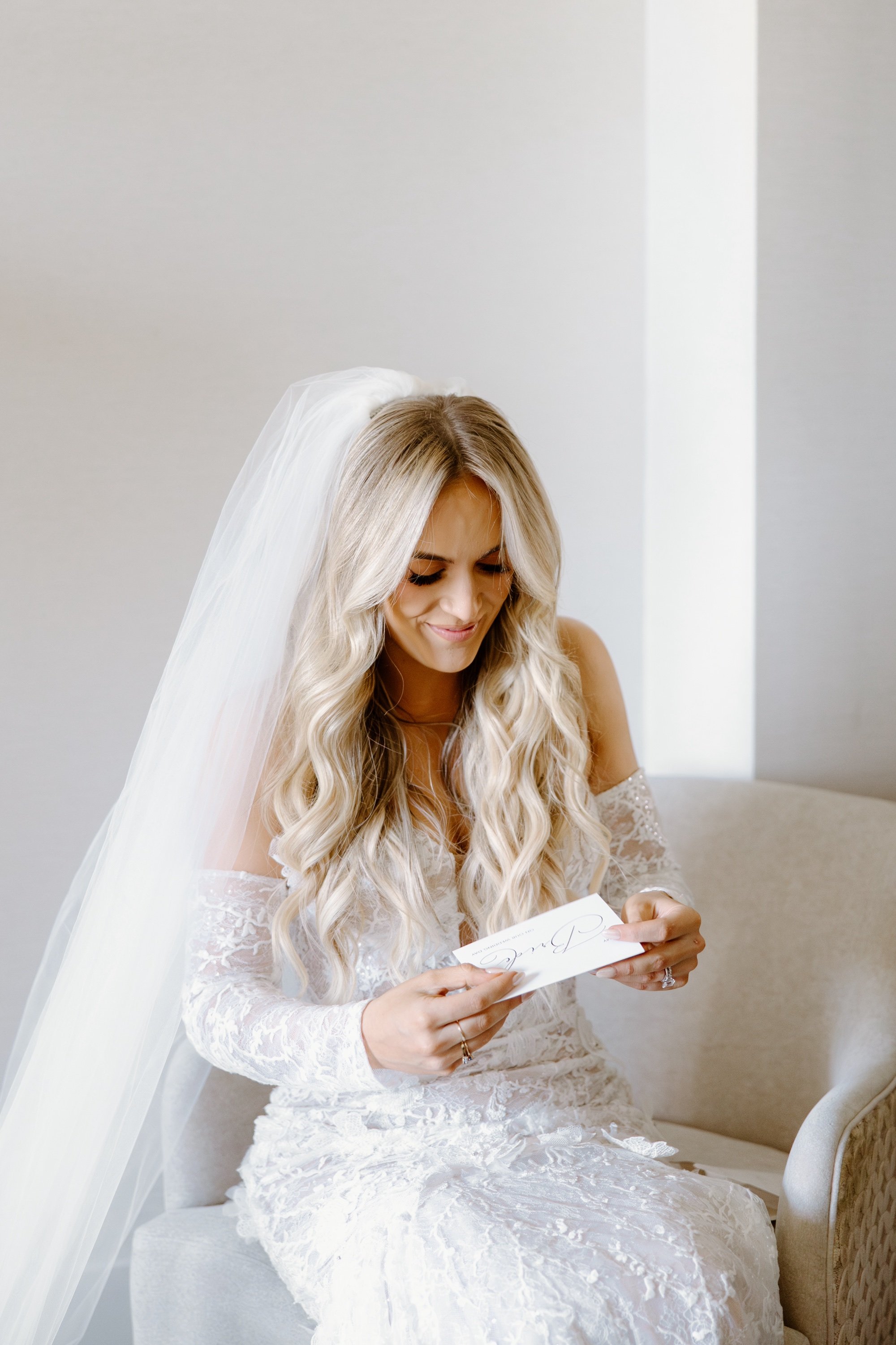 lace wedding dress with sleeves and cathedral veil