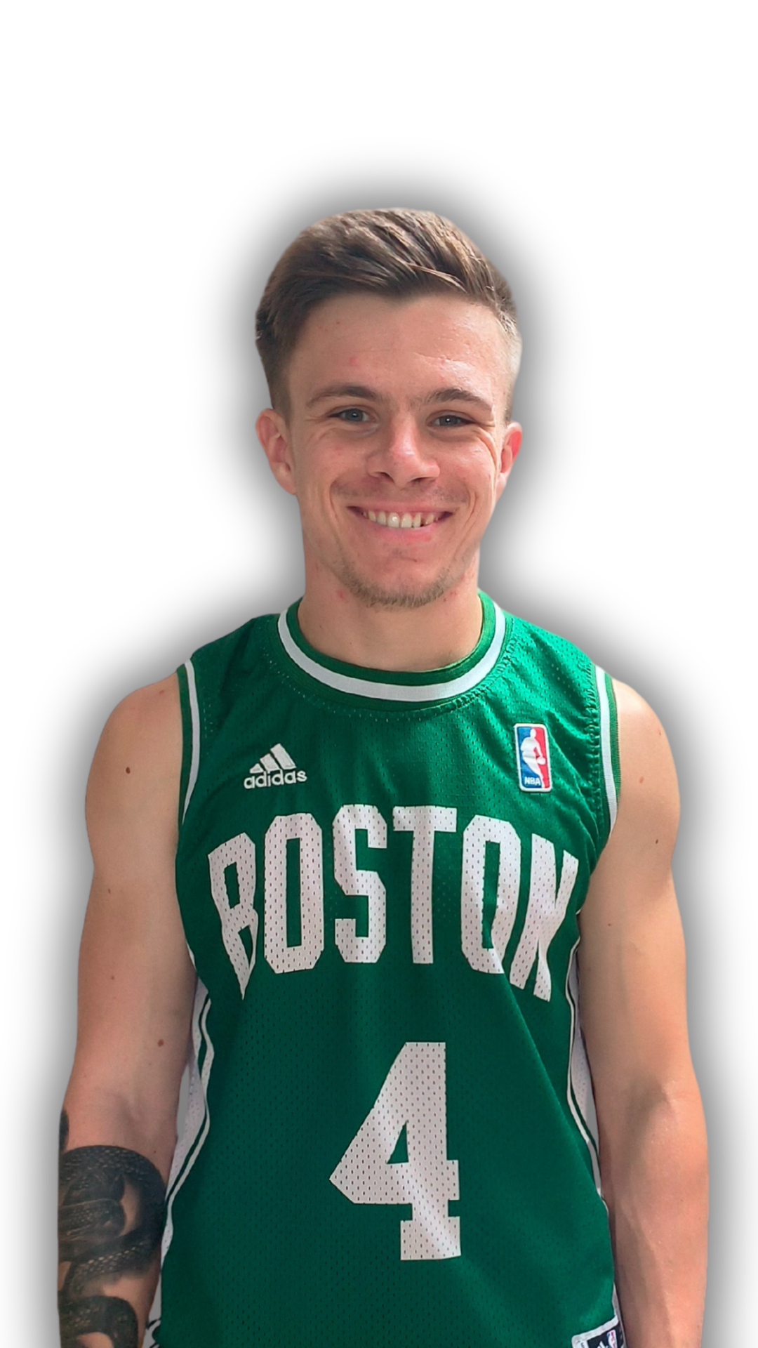 Young man with short brown hair, smiling, wearing a green Boston basketball jersey with the number 4 and the NBA logo.