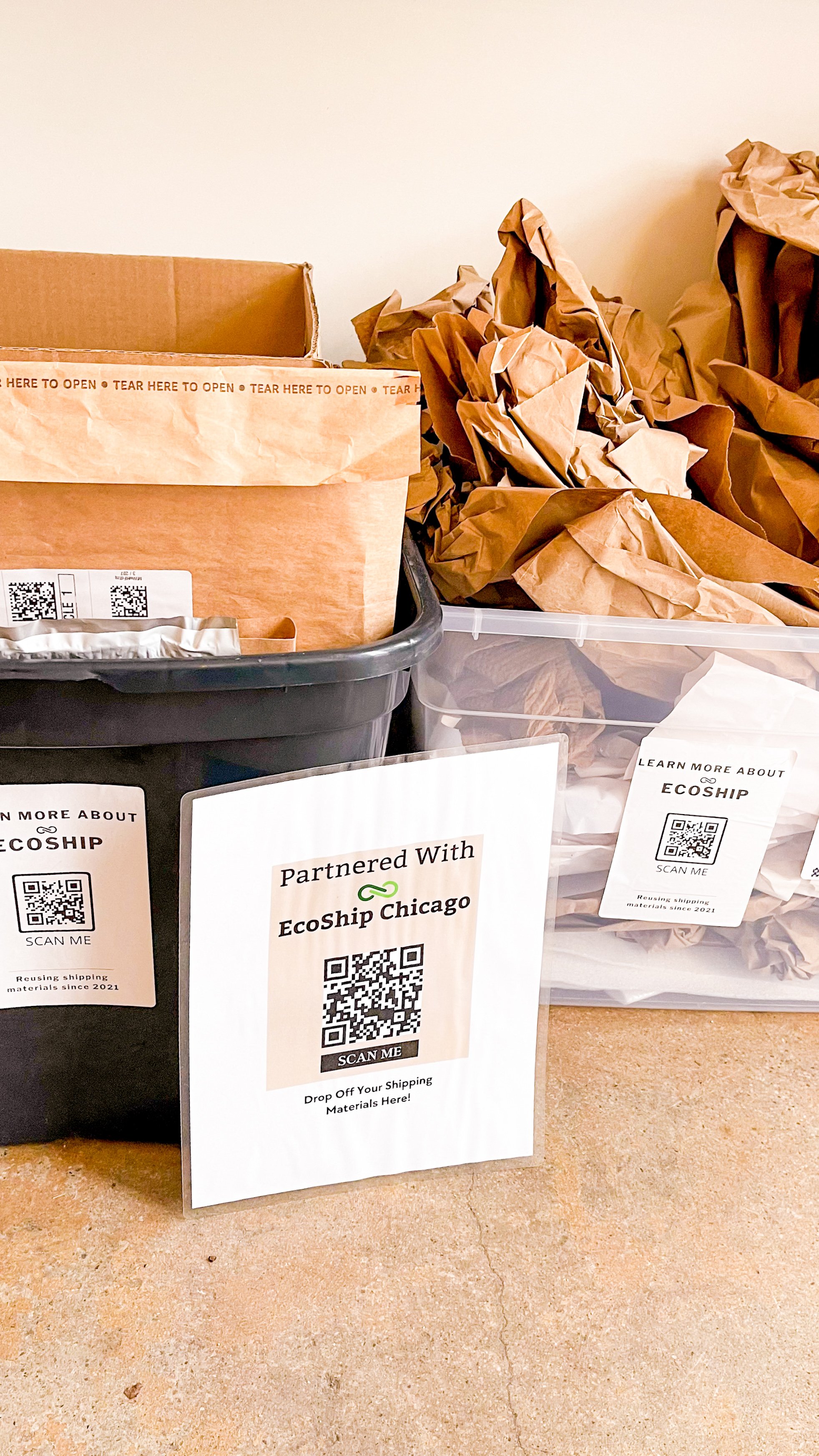 Multiple containers filled with recycled shipping materials.