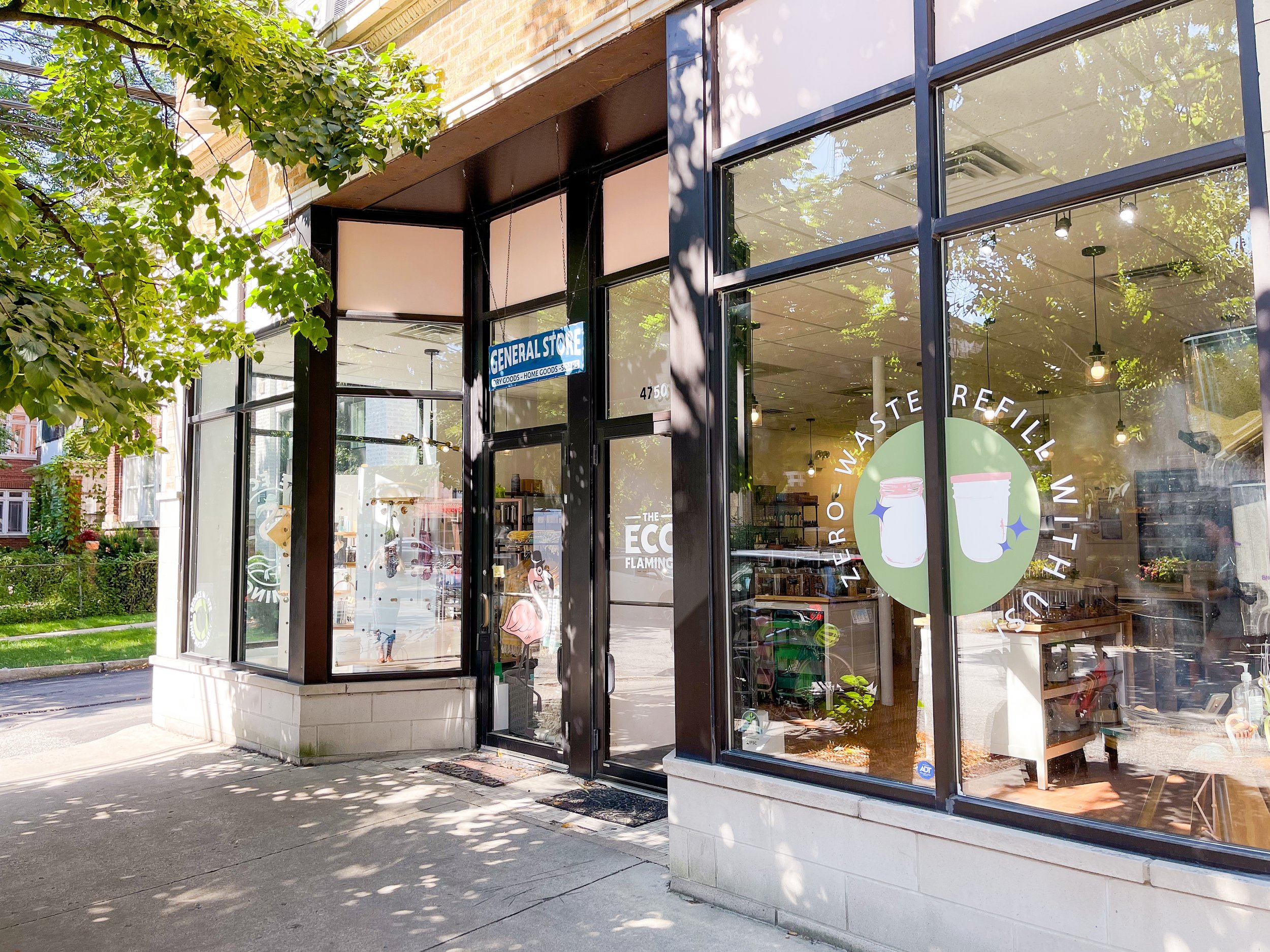 Storefront with large glass windows displaying the name Zero Waste General Store.