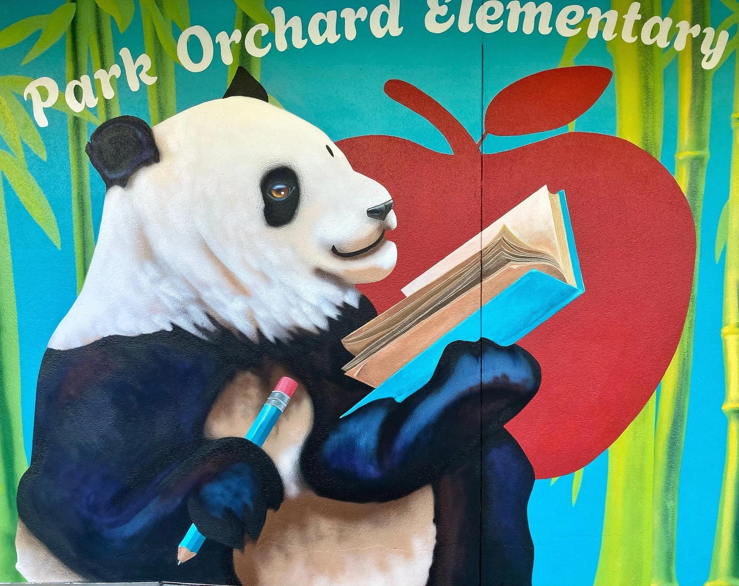 Acorn Murals Shelly Metzger Hungry for Knowledge Panda mural for Park Orchard Elementary School Kent, WA Close up of panda holding a book and pencil