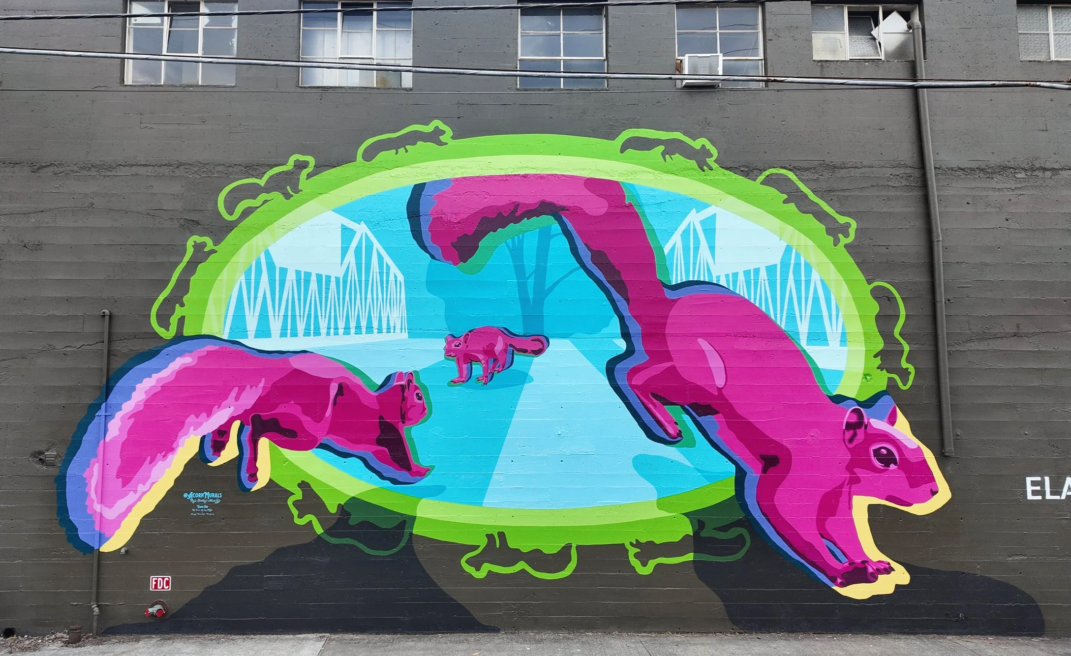 Acorn Murals Shelly Metzger Places to Go mural was painted in partnership with The Broad Strokes Project, for the town of Longview, WA. Located on the backside of the Elam's building off of Commerce Ave, it was inspired by Longview's famous squirrel 