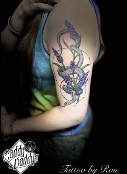 snake and lavender flowers tattoo