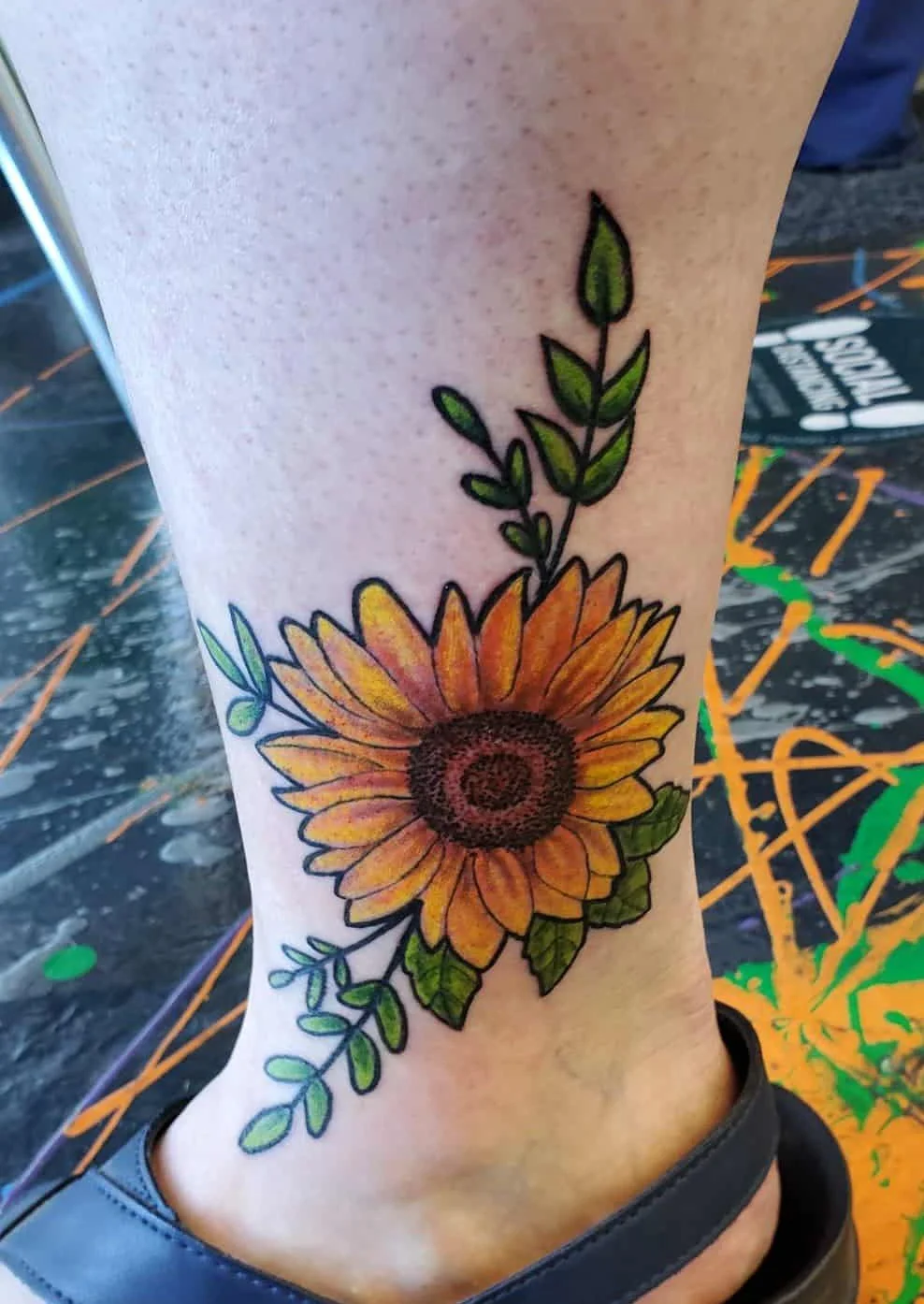 sunflower ankle tatoo done by a Redding tattoo artist