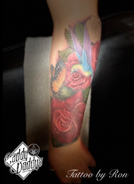 Full color flowers and butterfly tattoo from a Redding tattoo artist