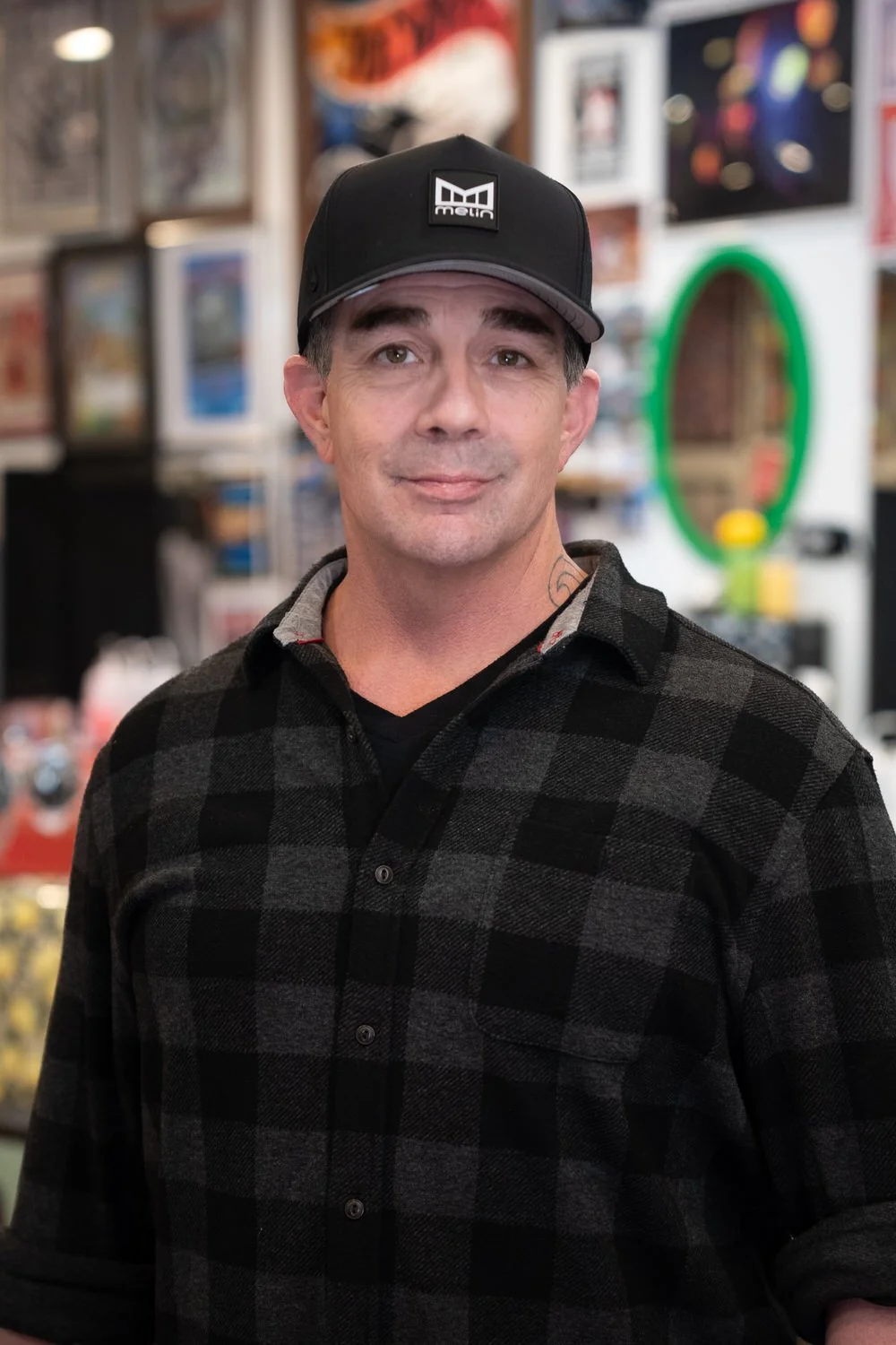Tattoo artist at Caddy Daddys in Redding providing custom fine line and traditional tattoo work in a clean, professional tattoo studio.