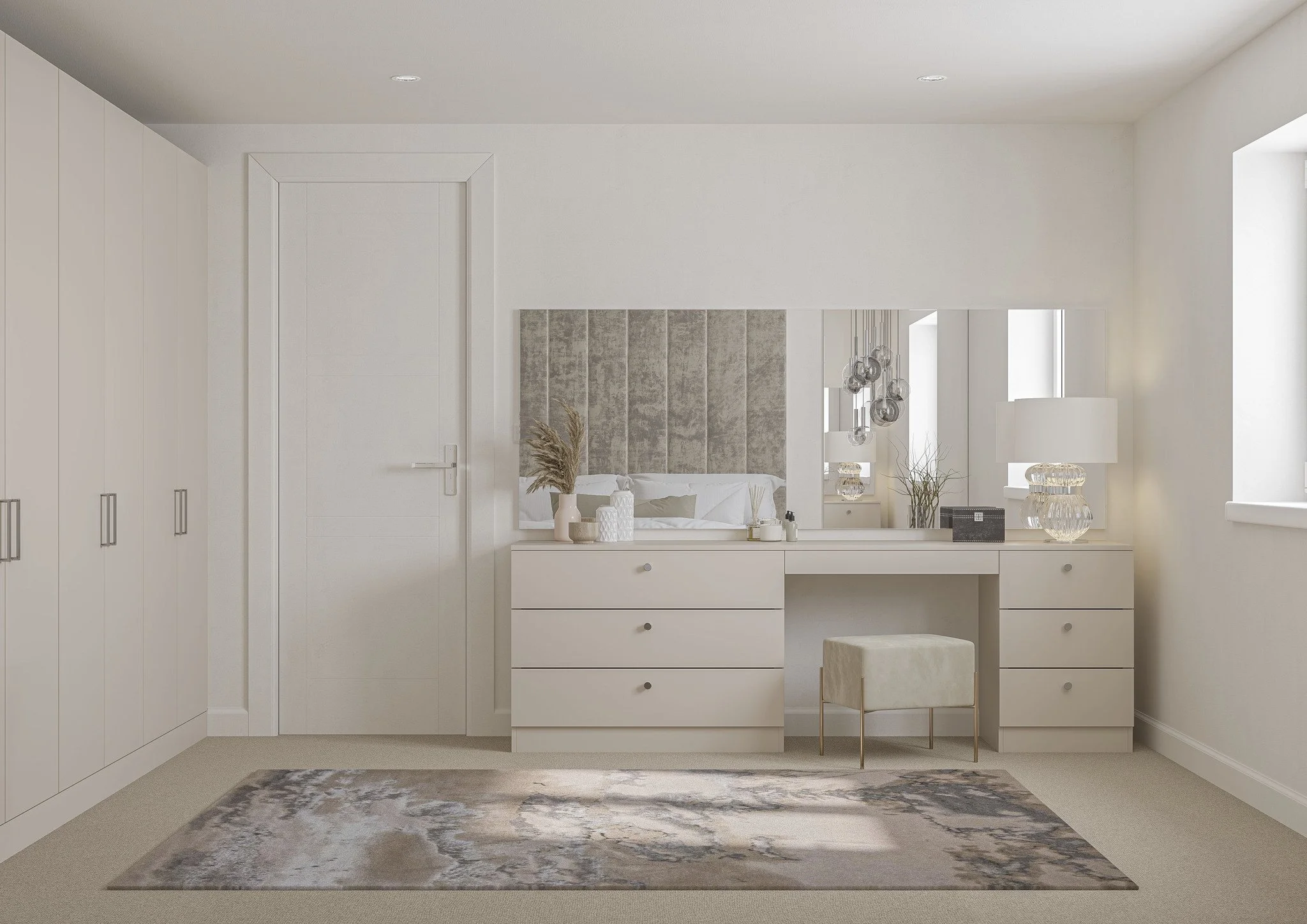 Minimalist bedroom with light-colored furniture, including a vanity with a mirror, decorative items, and a lamp. A padded stool is in front, with built-in cabinets and a modern rug on the floor.