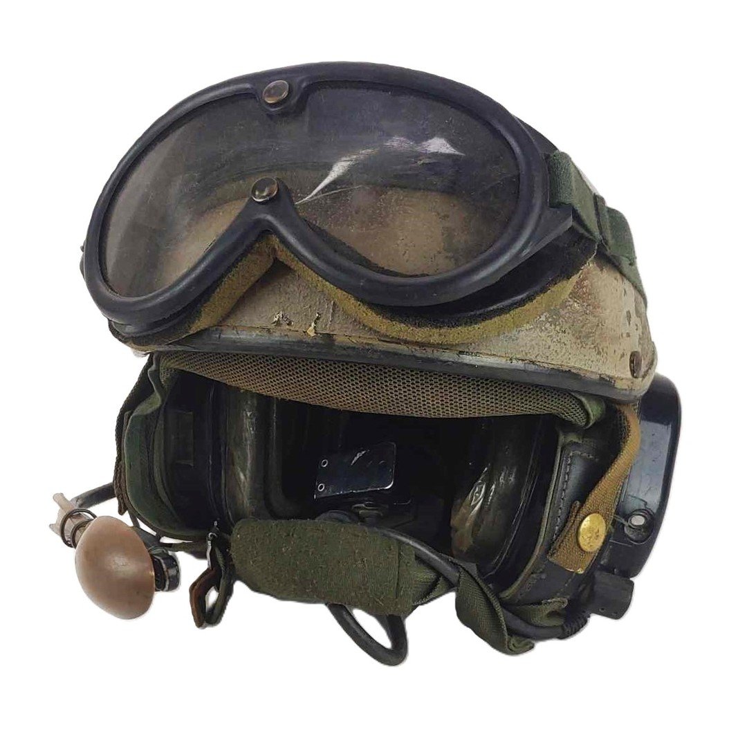 Combat Vehicle Crewman (CVC)
Worn by a member of the 136th during the GWoT. This helmet, found in a pallet of helmets that were marked as property of the 136th and were being removed from service, is a veteran of combat operations in Iraq. A spray de