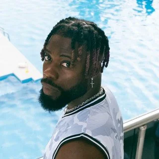 Photo of the Producer, SarmyFire, in front of a pool
