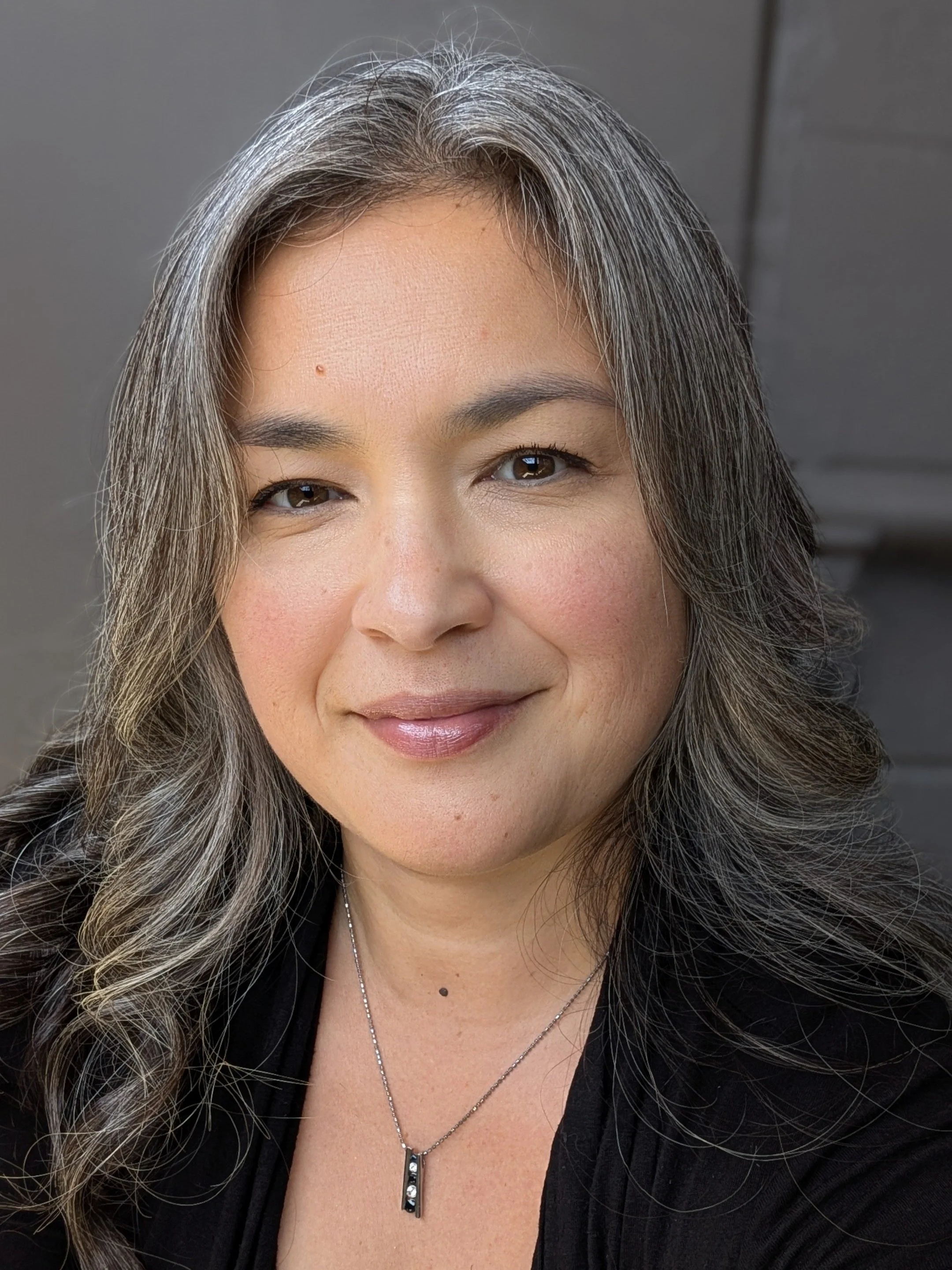 Natalie Jacobs, Music Metadata and Rights Management Consultant, who is an expert that has overseen $17M in music data portfolios. Professional headshot for Equalizer Consulting.