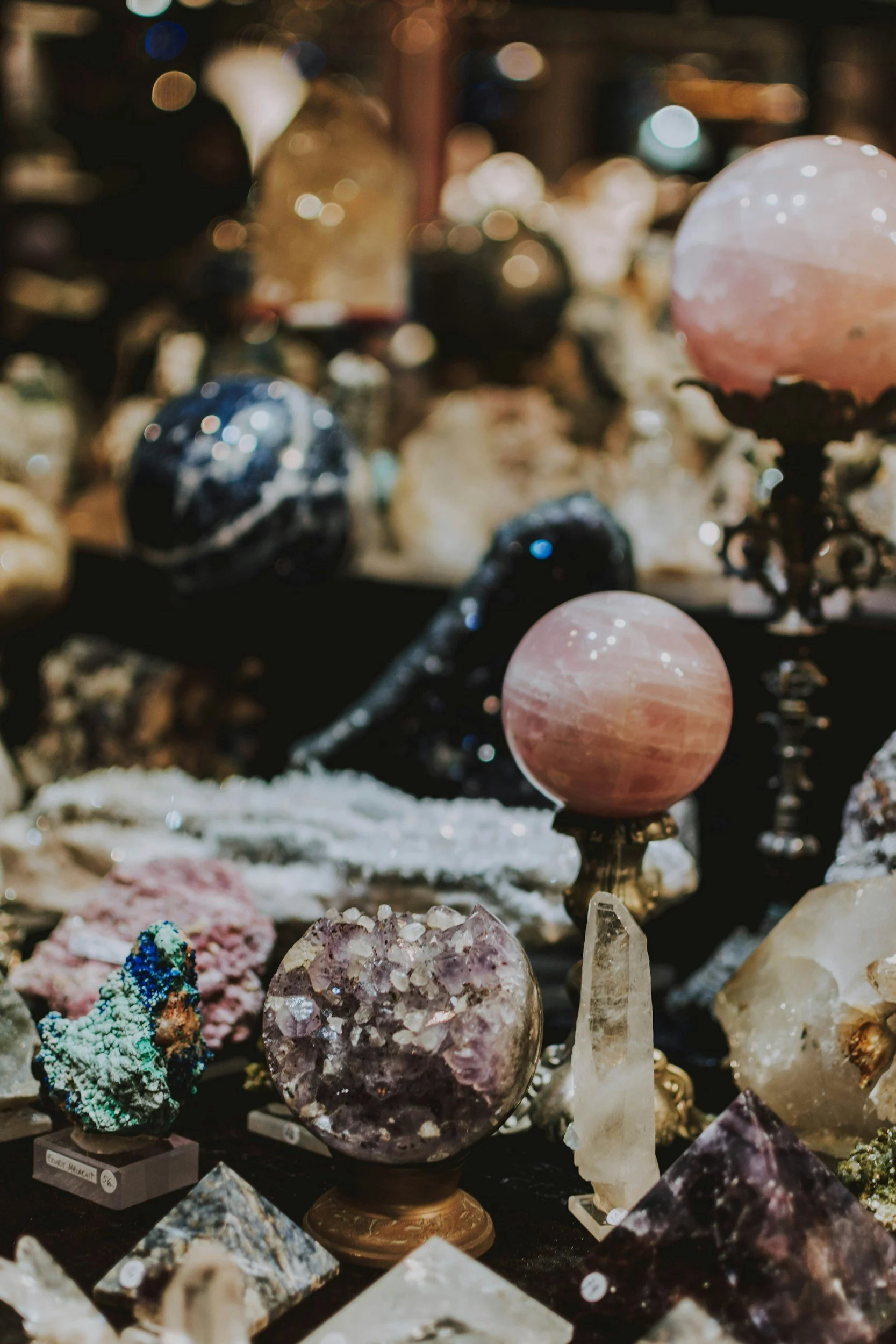 Display of  multicolored mounted polished and raw crystals inside a Crystal Shop.