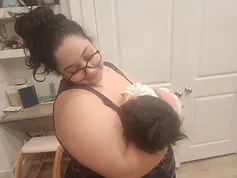 Woman holding a baby in a domestic setting