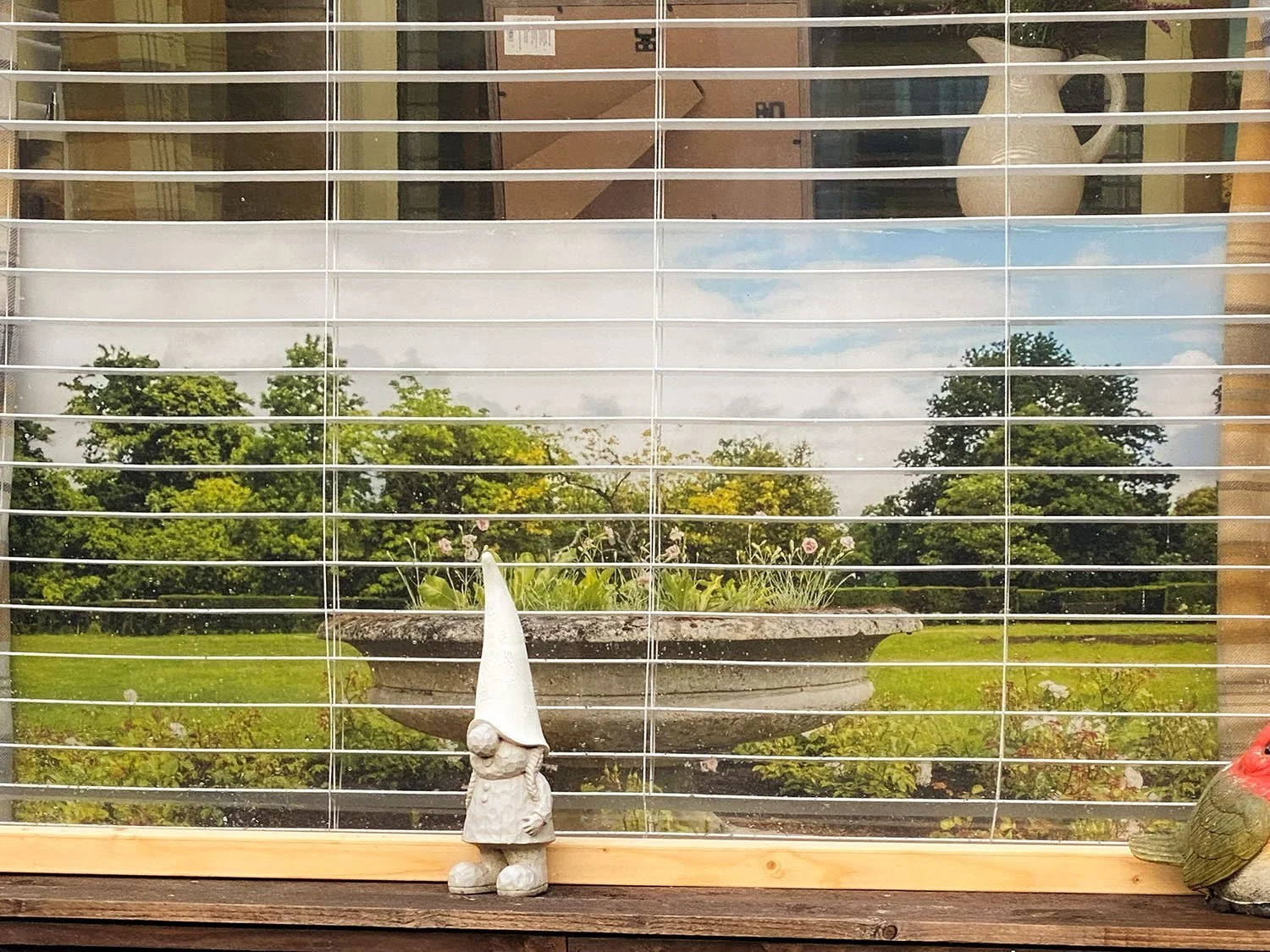 A garden view with wild flowers custom printed and fitted to the back of an indoor desk to add colour to the garden view