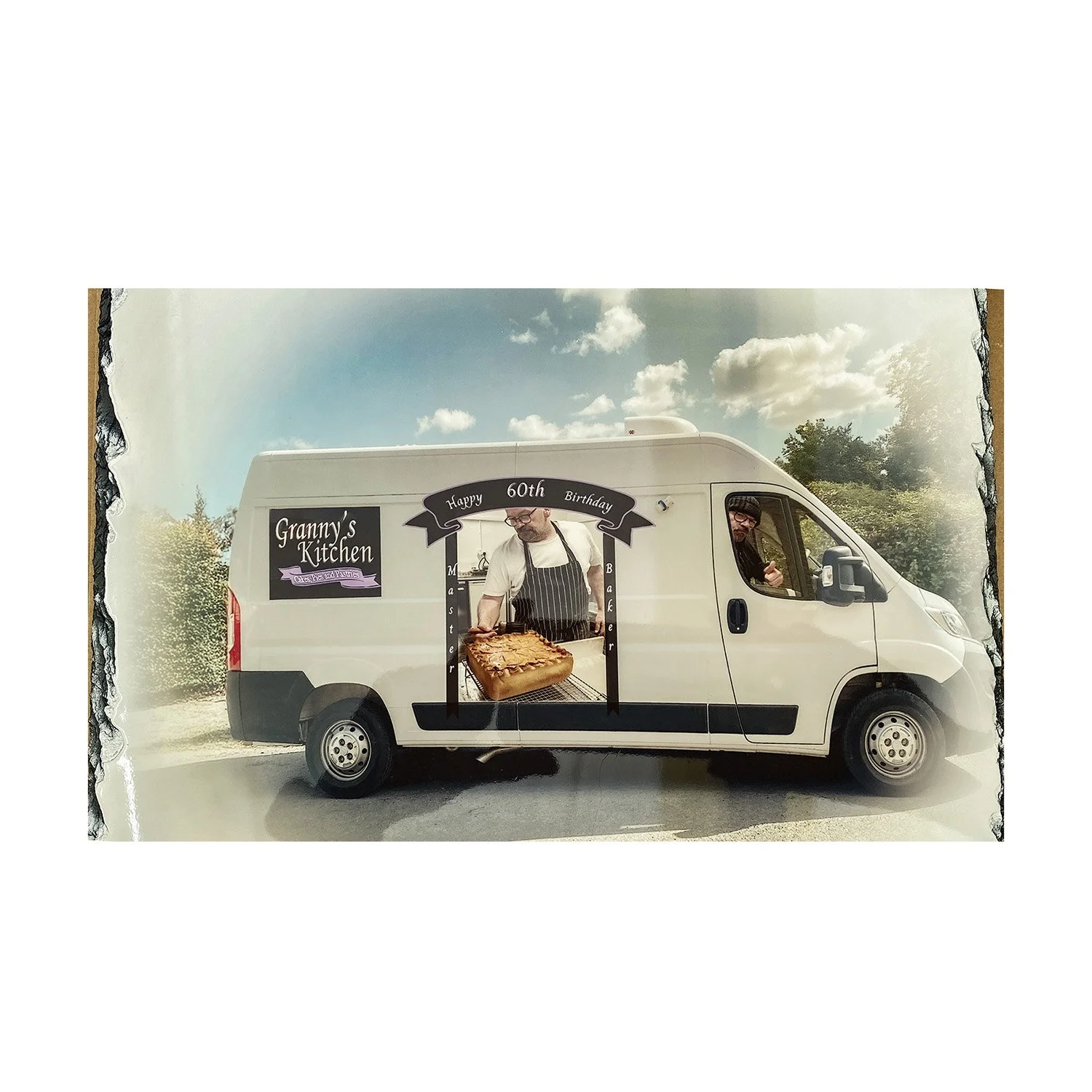 Food truck celebrating Granny's Kitchen's 60th birthday with a chef serving baked goods and a sign showing 'Happy 60th Birthday'
