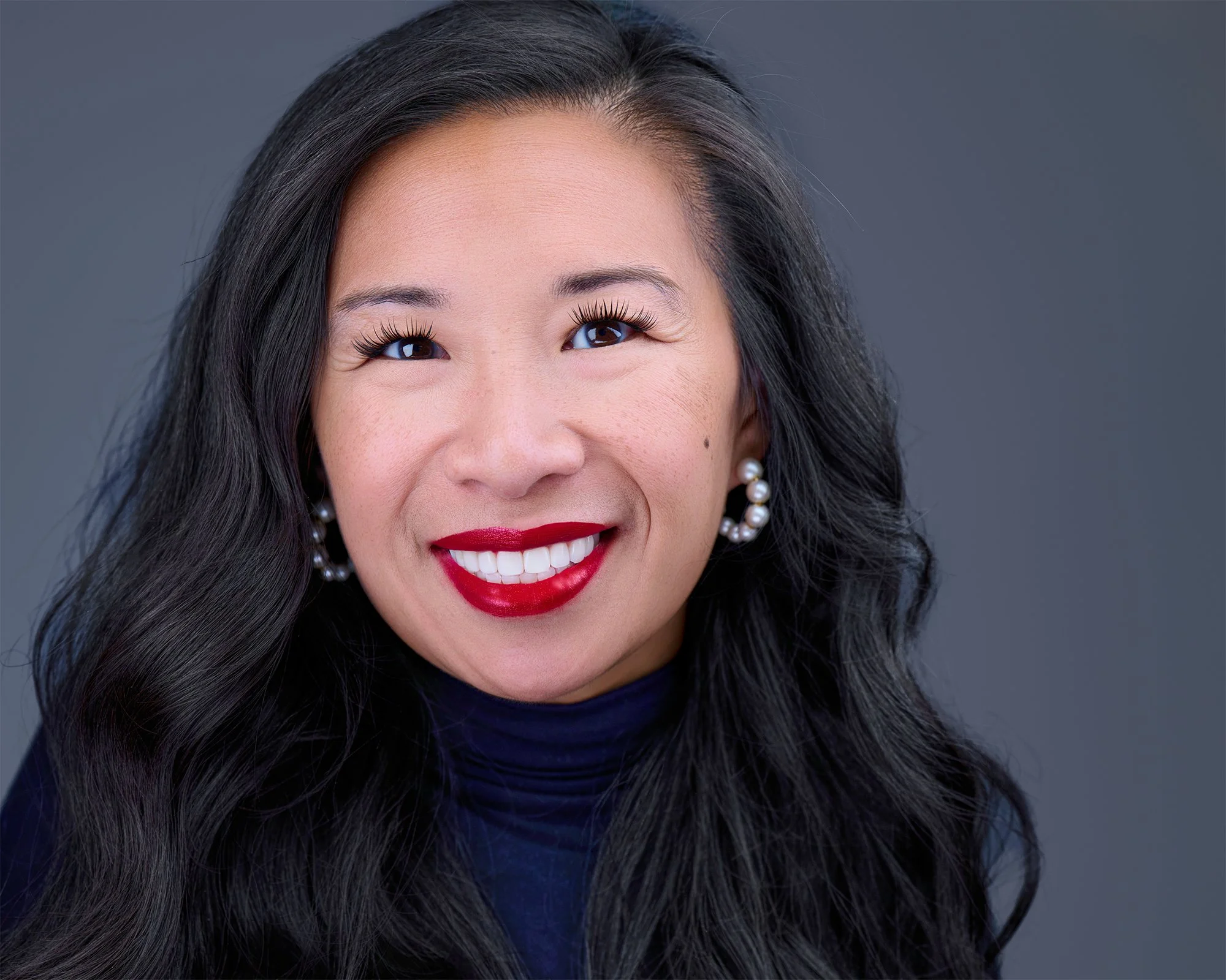 Professional headshot of a woman featured in the blog ‘Choosing the Right Background for Your Headshot’ by Deborah Heinlen Photography in Northern Kentucky and Cincinnati.