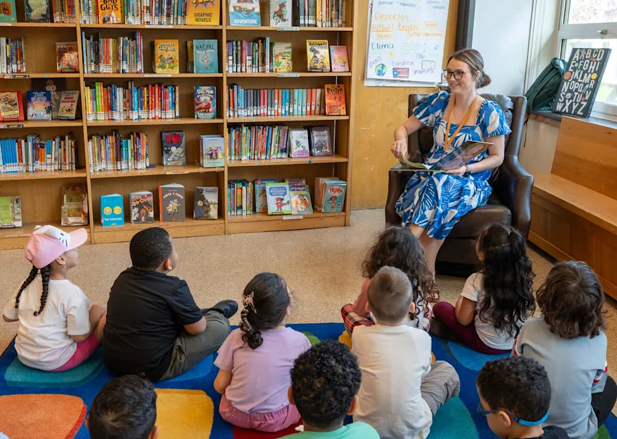 Mrs Tillo Reading in the WorDL library.png