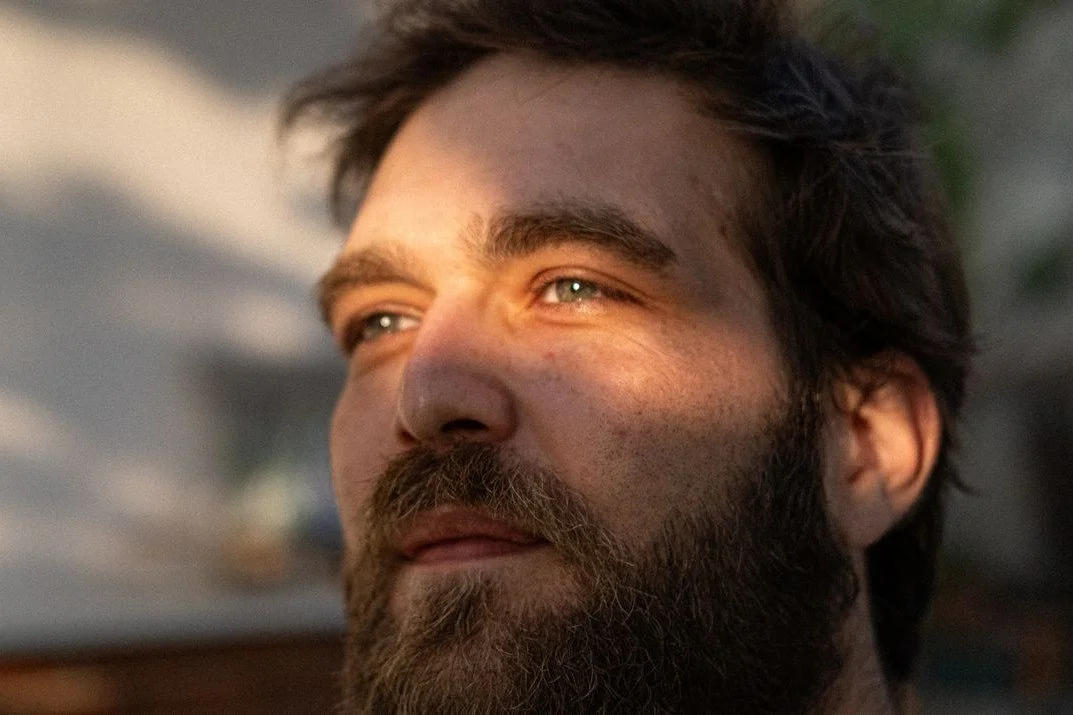 golden-hour-portrait-of-reflective-man-outdoors
