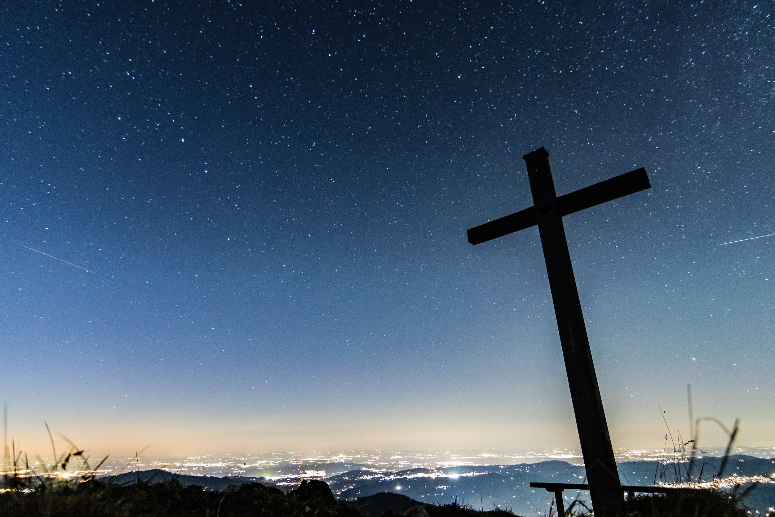 midnight cross on hillside.jpeg