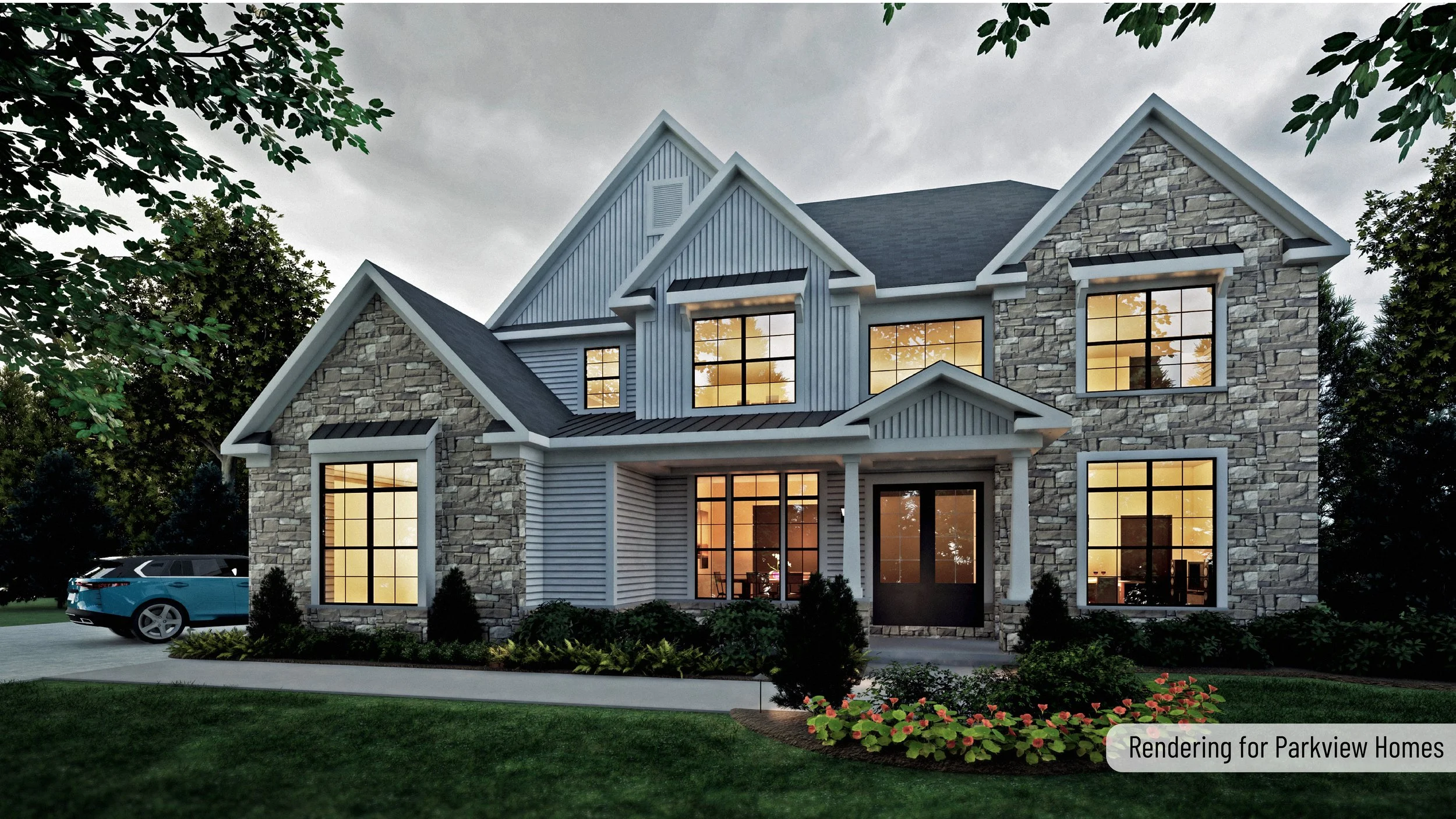 A modern two-story house with stone and siding exterior, large windows with black frames, and a front porch with white columns, set amidst green landscaping including bushes and flowers, during dusk with interior lights on.