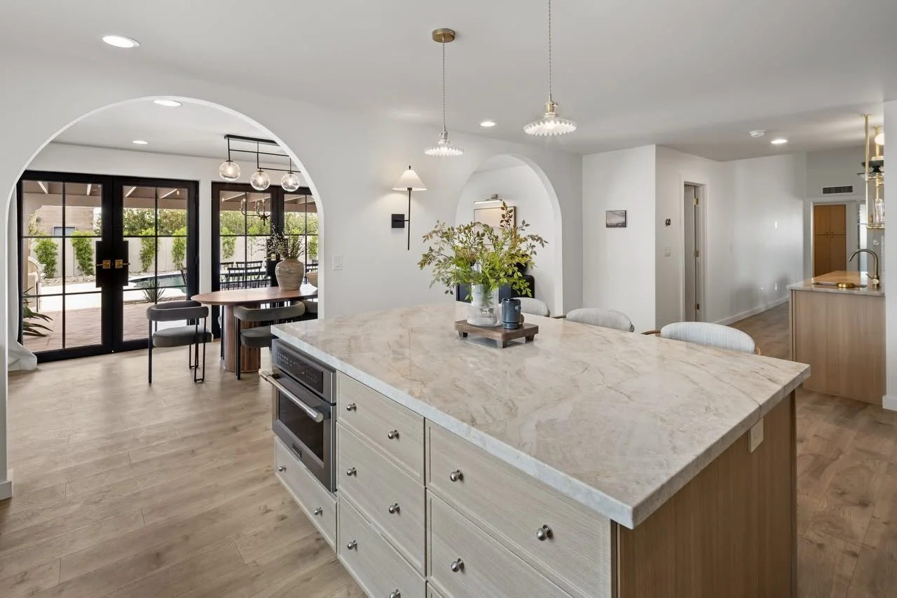 We didn&rsquo;t redecorate this house. We redrew it.⁠
⁠
Three sets of French doors cut into the exterior. Arches softening every threshold the 90 degree angles used to harden. The kitchen relocated to where the house had always wanted it. Two bathroo
