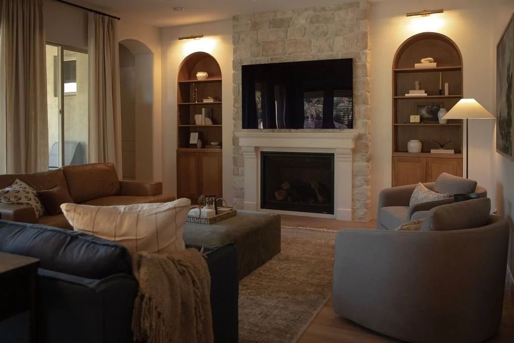 Timeless earthy living room with relocated fireplace and custom white oak cabinetry