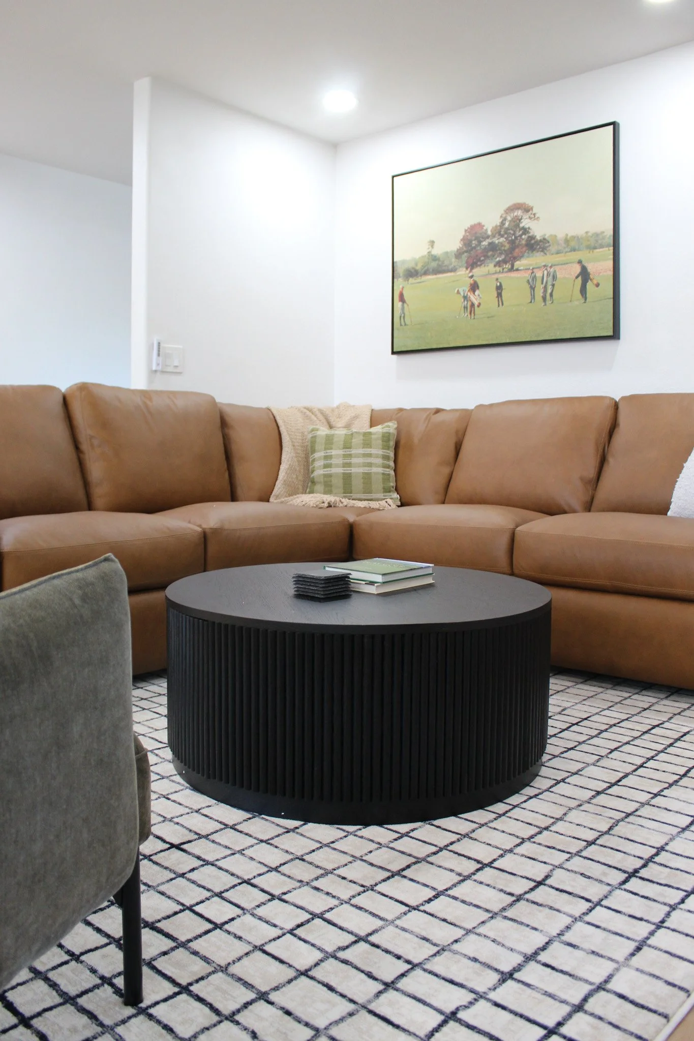 Luxury Airbnb living space with neutral tones and wood accents