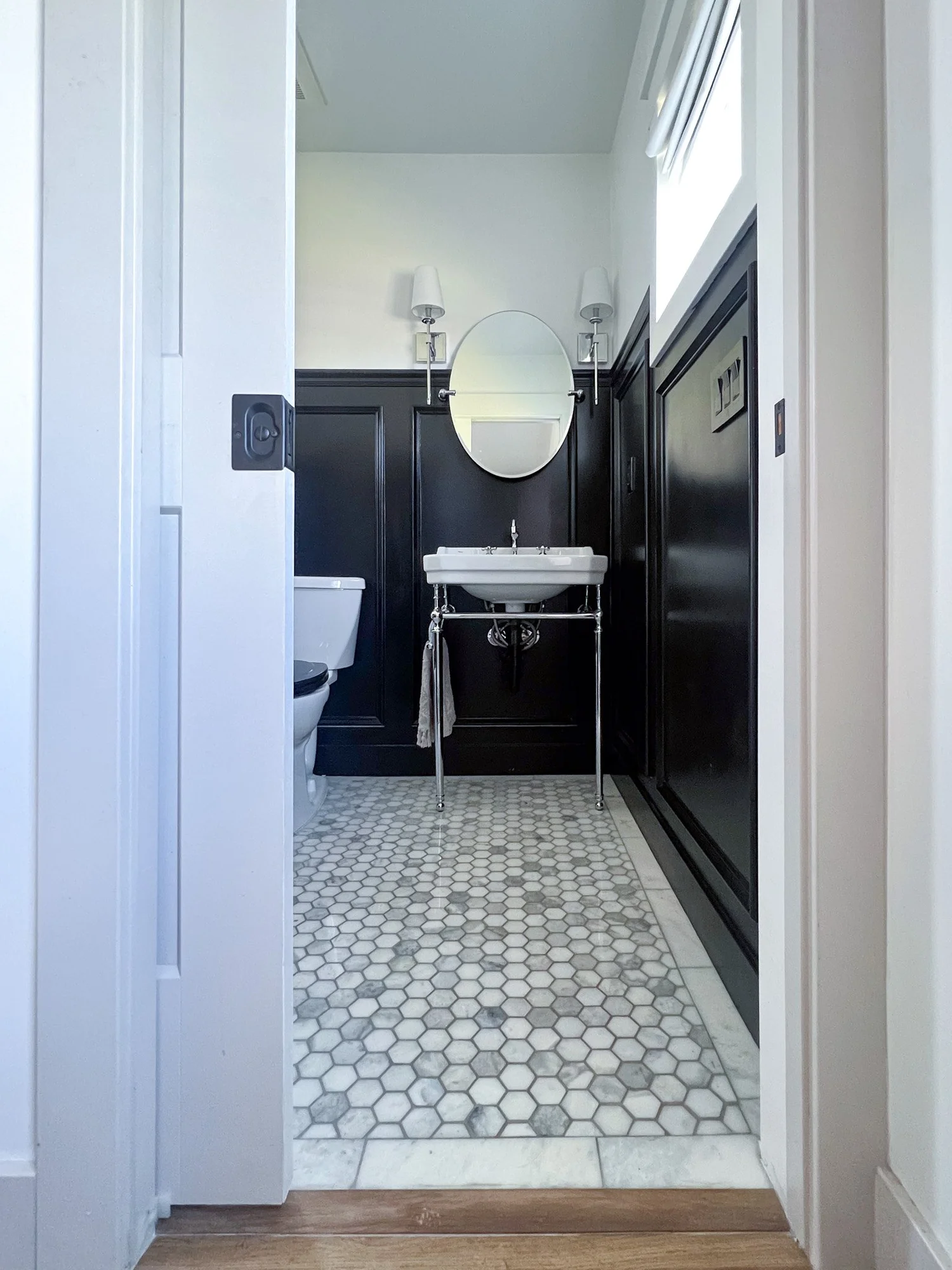European-inspired bathroom with clawfoot tub and marble octagon floor