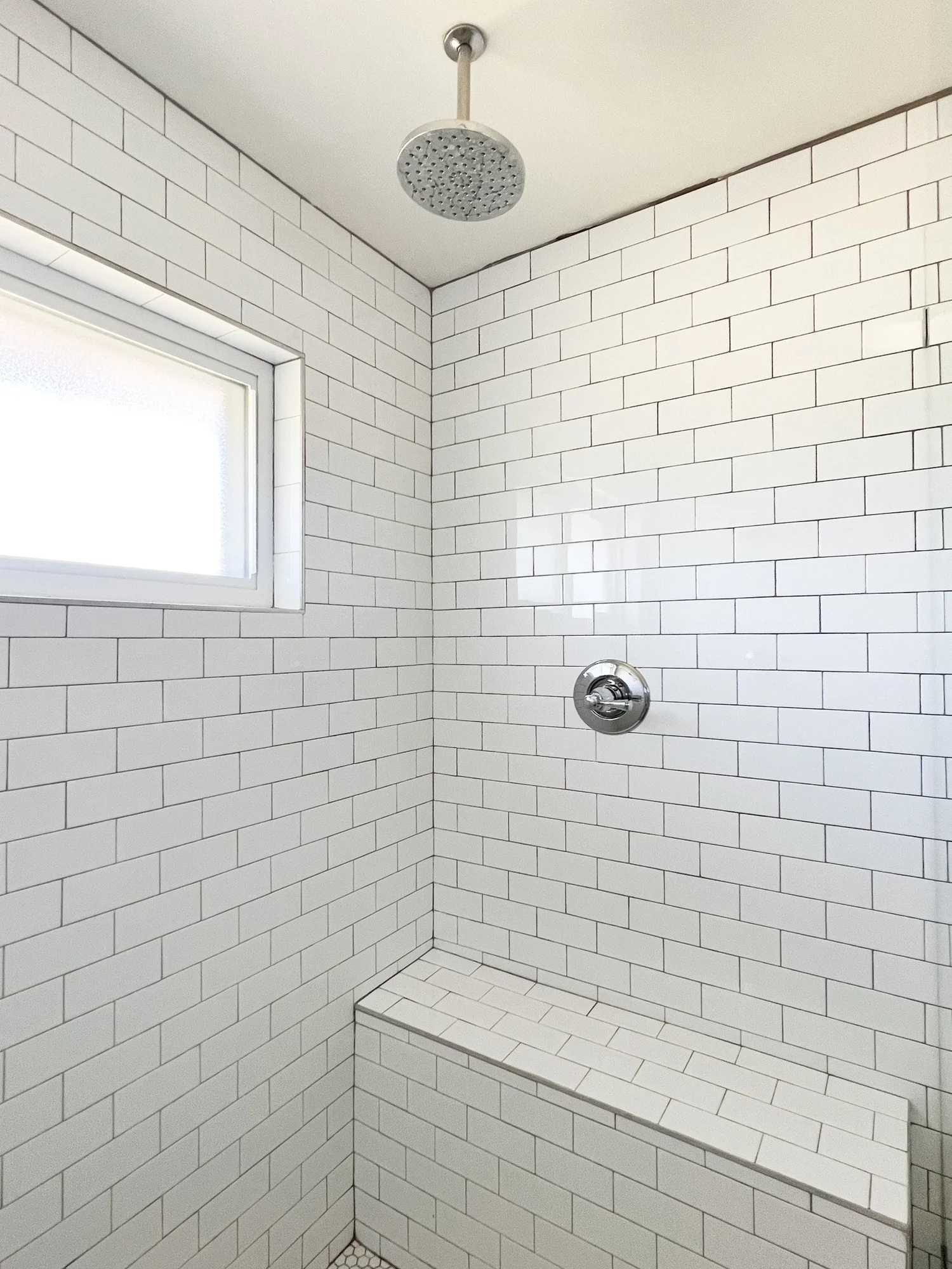 Louvered closet doors and overall bathroom view