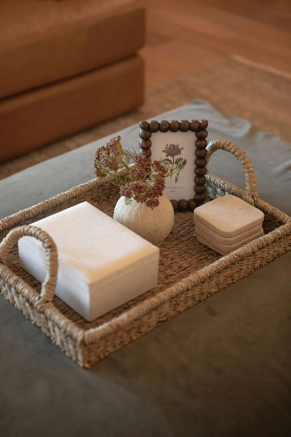 Coffee table styling with layered neutrals and organic textures