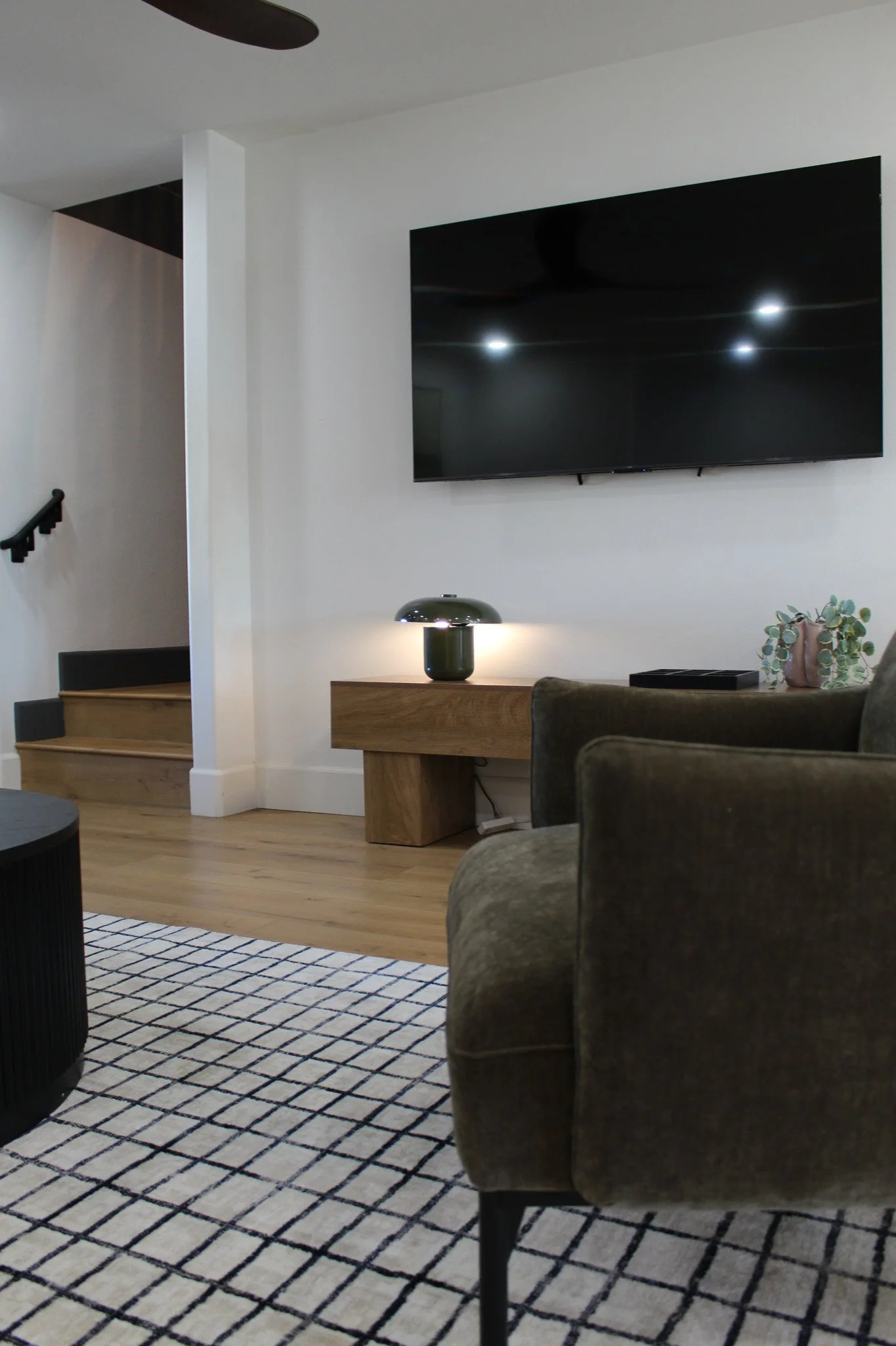 Luxury Airbnb living space with neutral tones and wood accents
