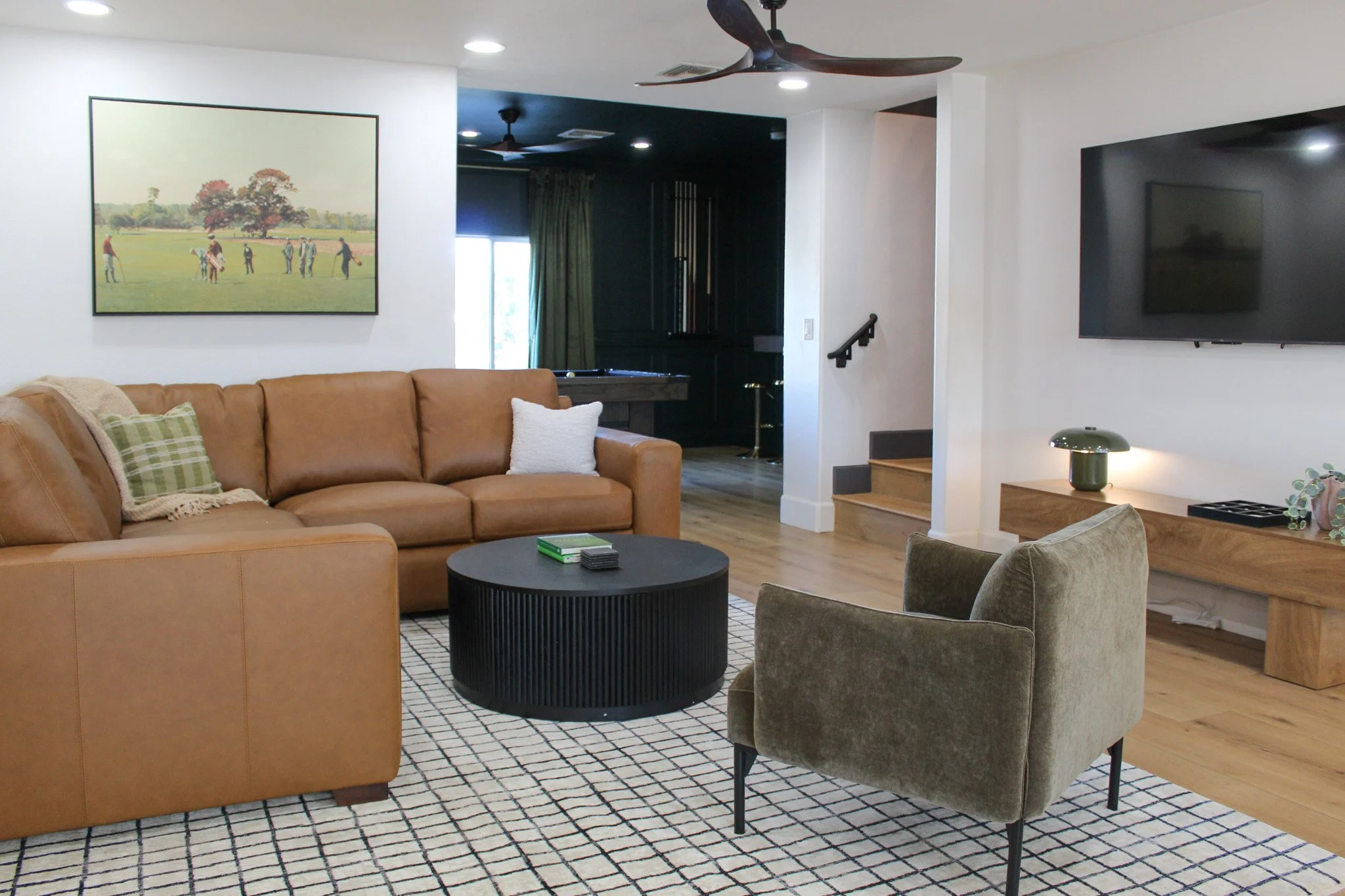 Luxury Airbnb living space with neutral tones and wood accents