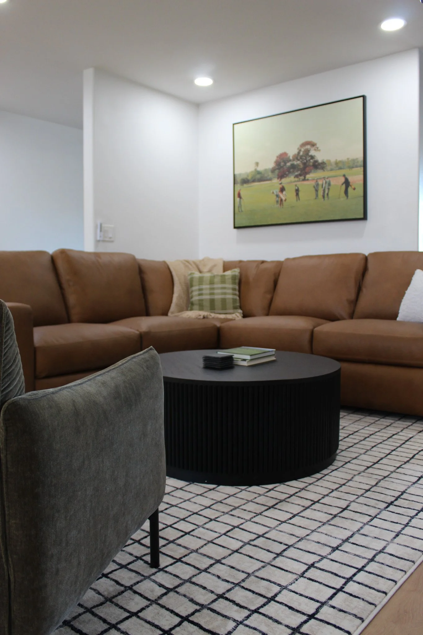 Luxury Airbnb living space with neutral tones and wood accents