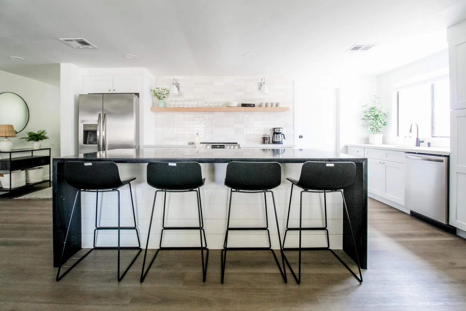 Open concept living and dining with neutral palette