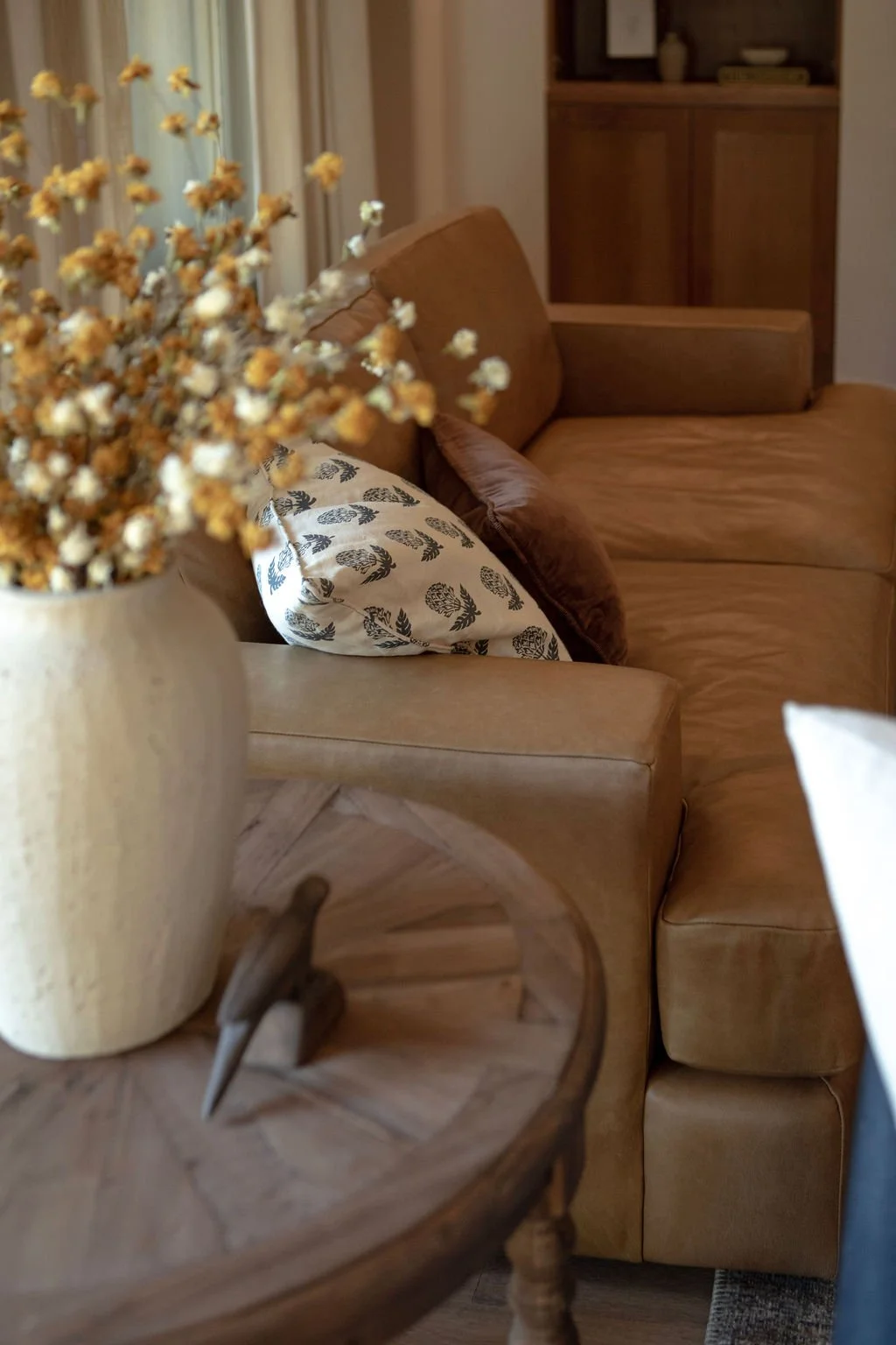 Seating vignette showing linen and leather material layering