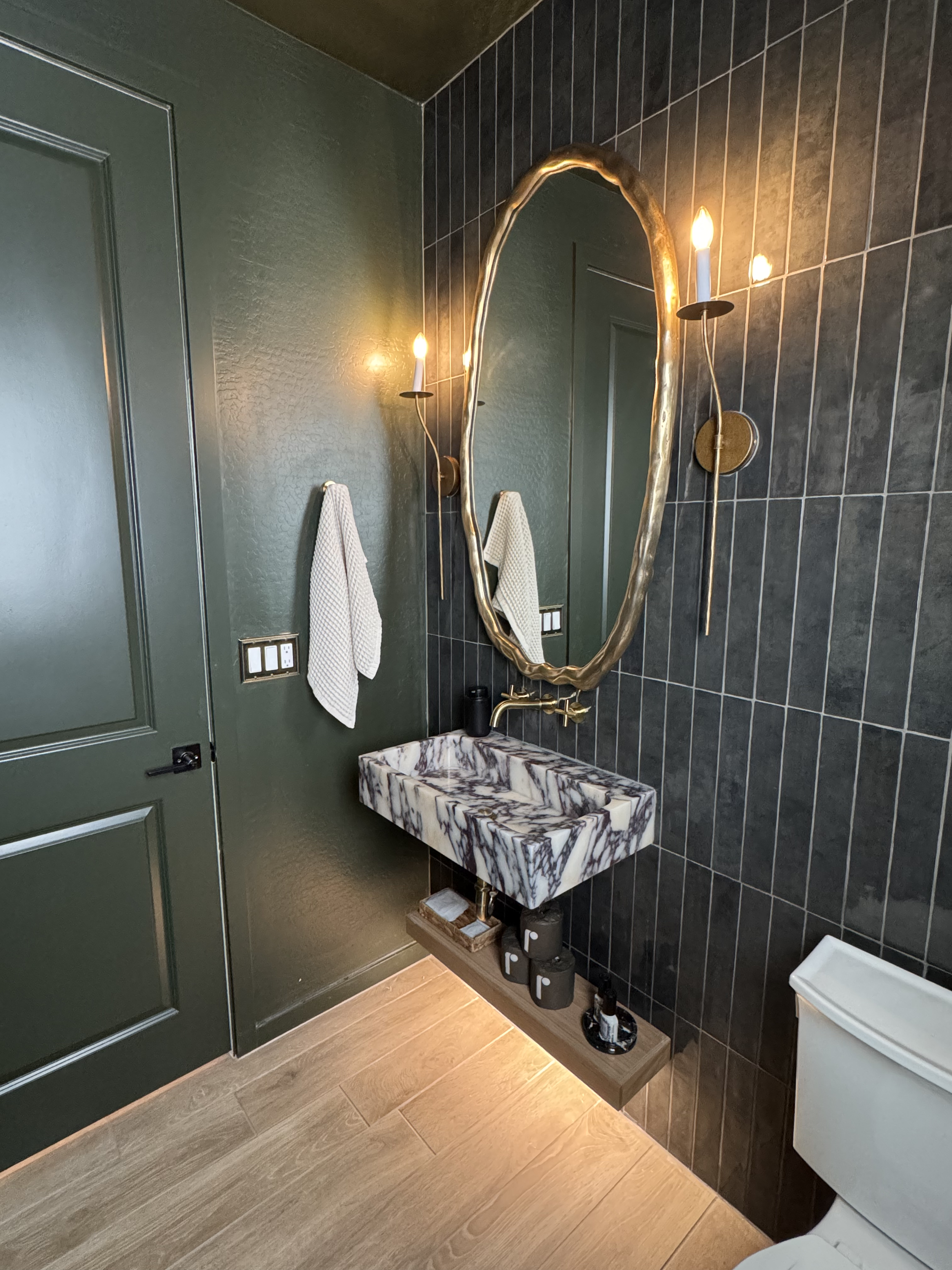 Brass sconce lighting in Modern Edgy Powder Room.