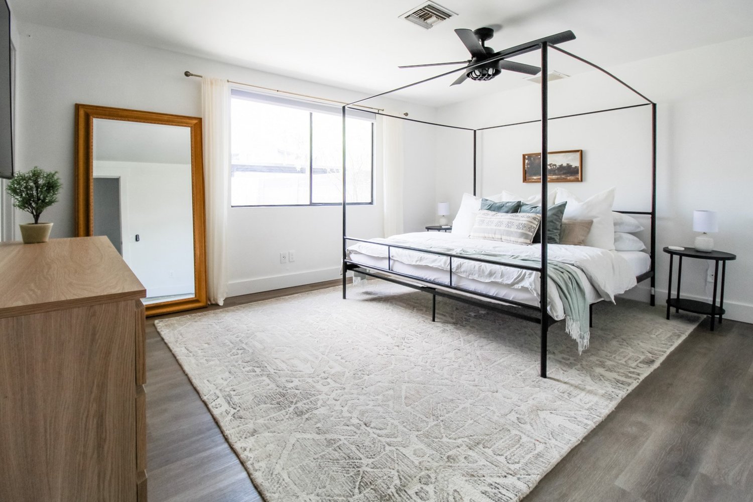 Texture layering with natural fiber rug and soft textiles