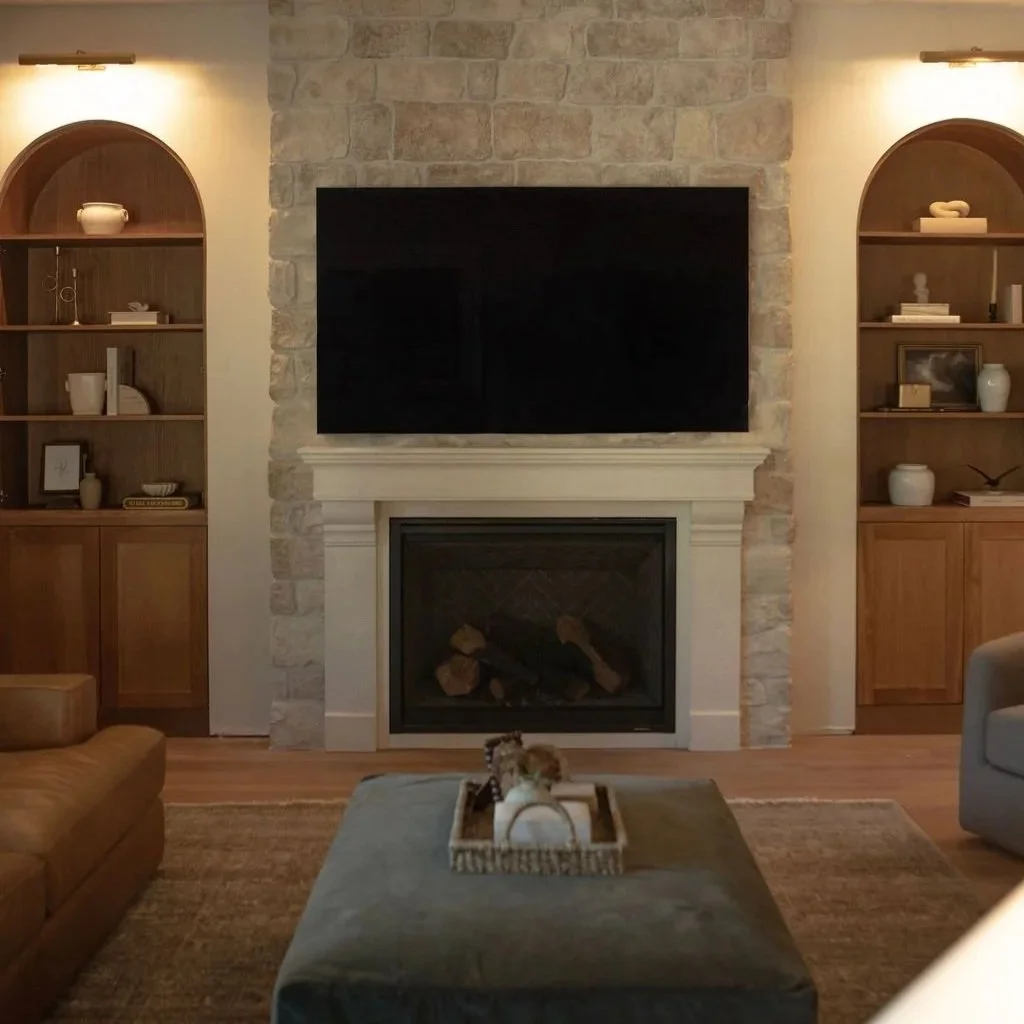 Vertical shot of earthy living room design with fireplace detail