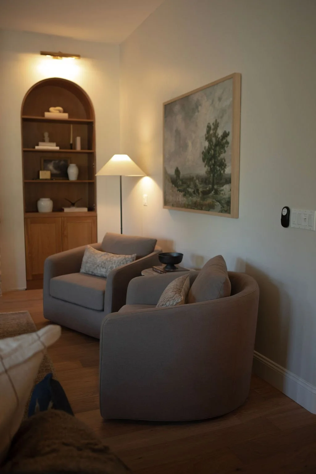 Living room vignette highlighting layered materials and warmth