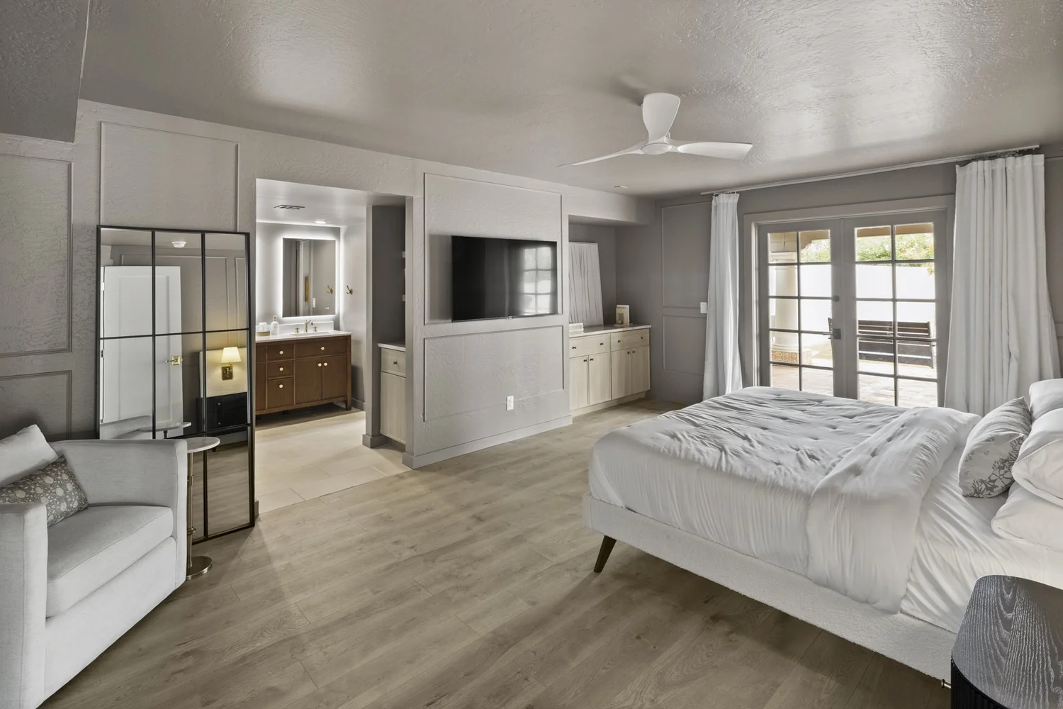 Primary bedroom with layered textiles and commissioned headboard