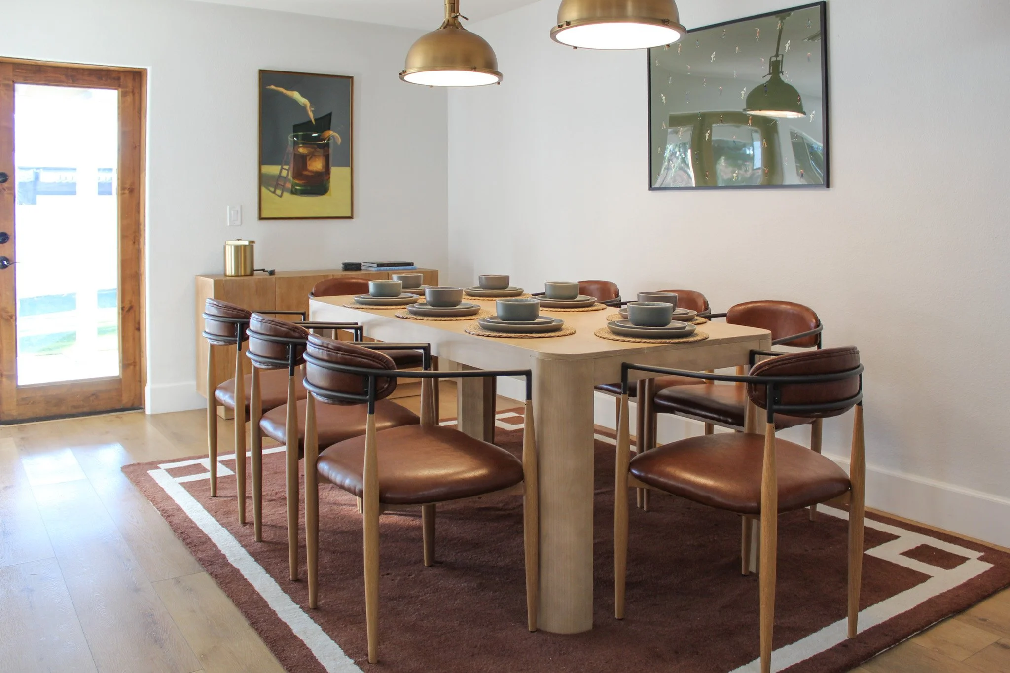 Airbnb dining room interior design with modern table and seating