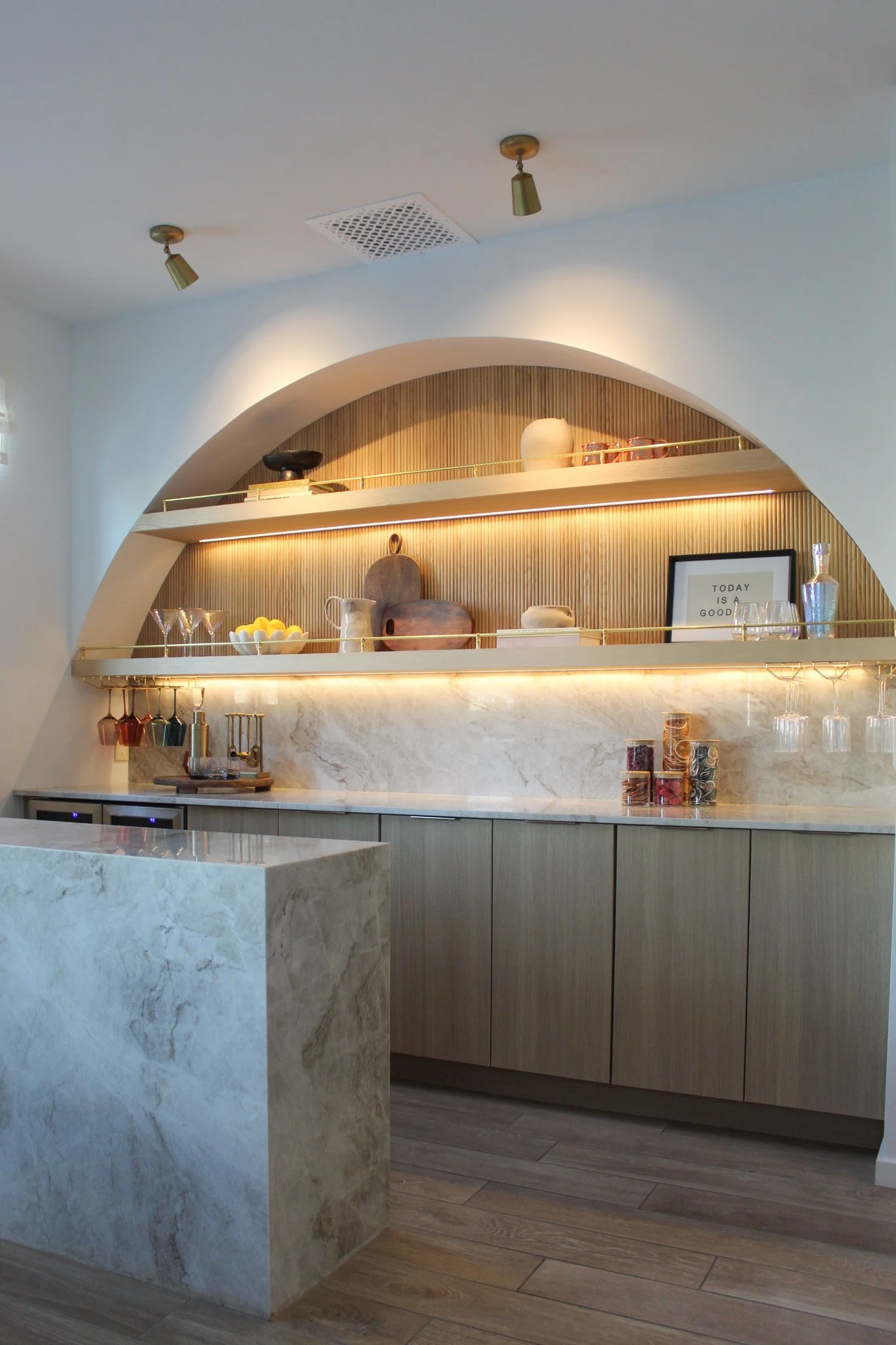 Integrated wine fridge and smart storage in modern glam pantry