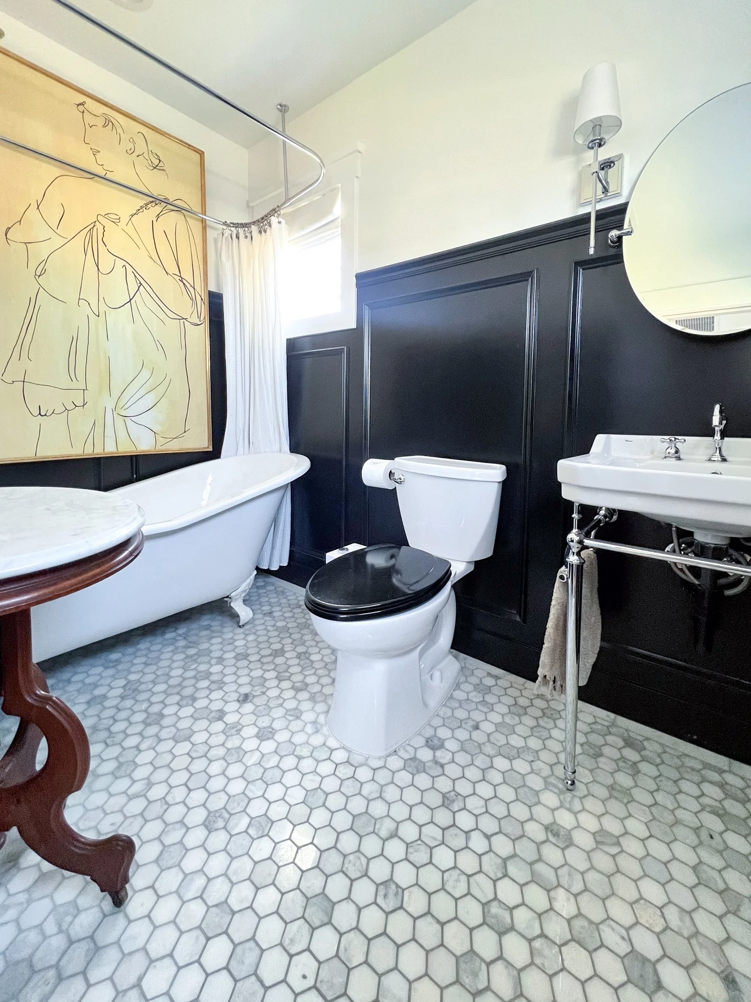 Bathroom showing full wall treatment and tub