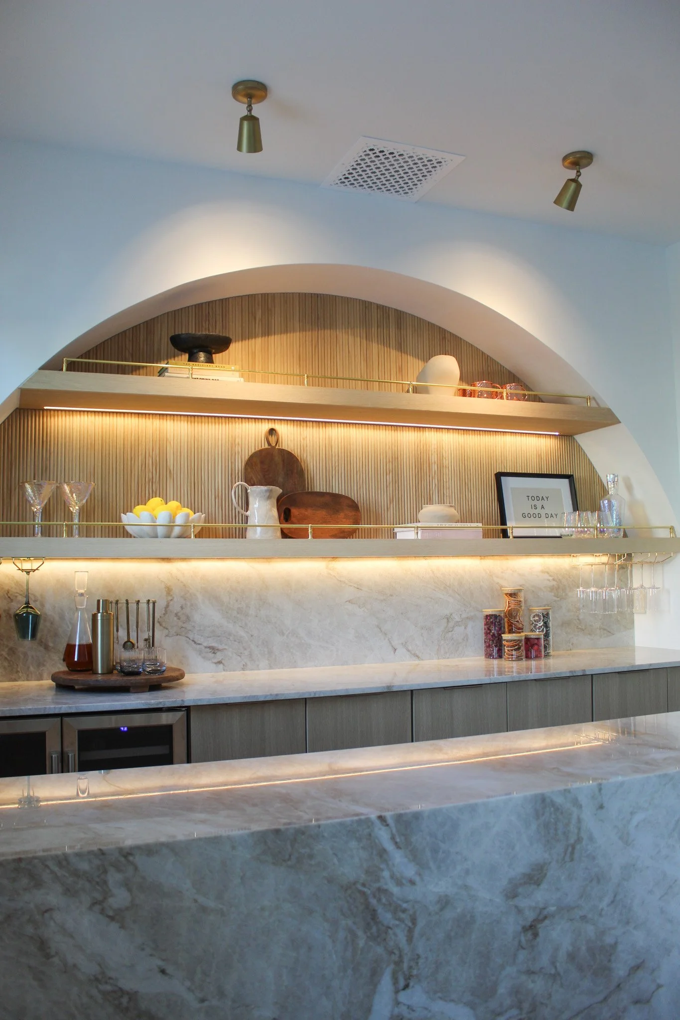 Modern glam bar and butler pantry with custom arched white oak millwork