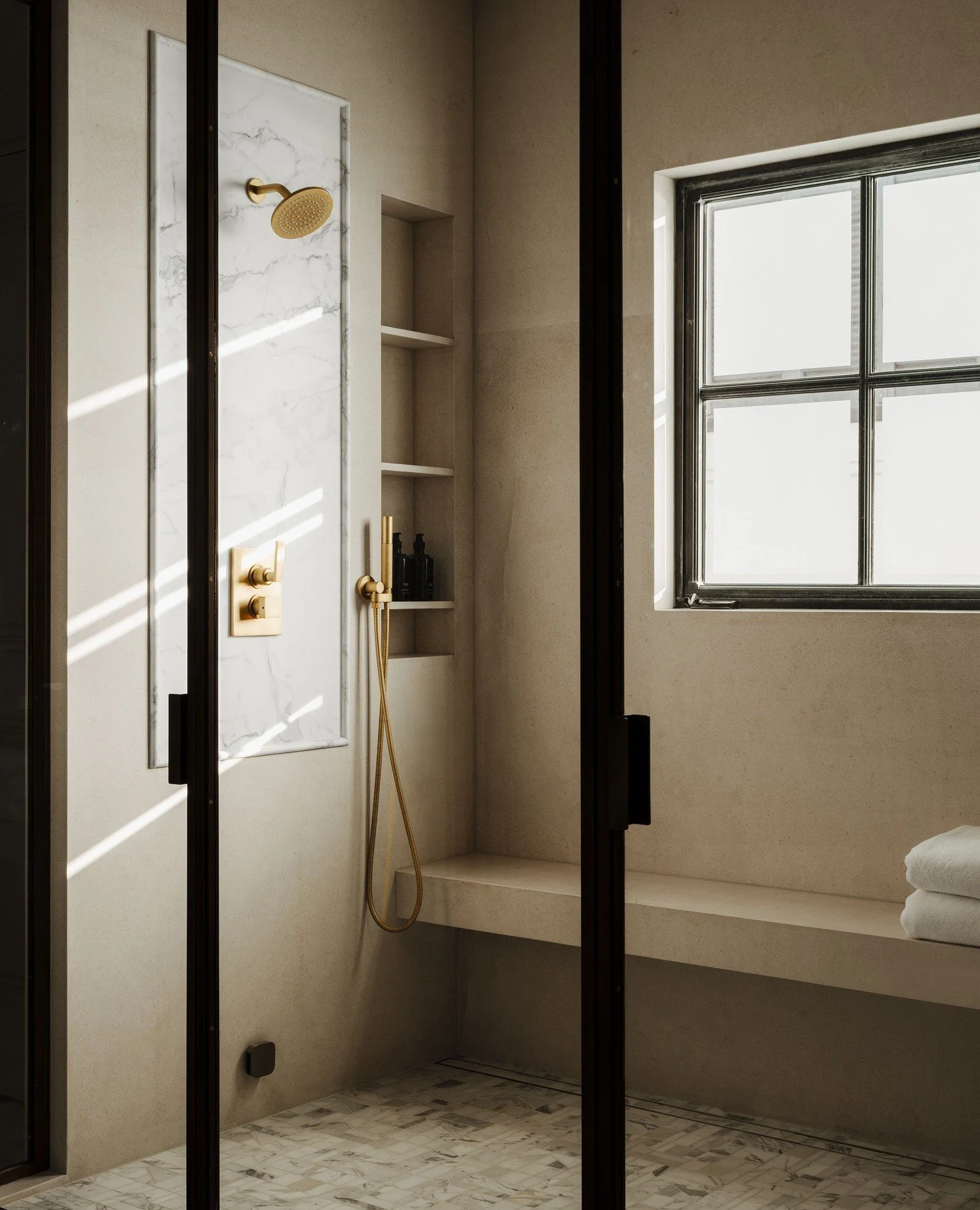 Sunday Reset 🛁⁠
⁠
We transformed the primary bathroom by removing the old bathtub to expand the shower and install a steam shower with a beautiful brass-and-glass enclosure. Then, we added a free-standing tub to make this space a tranquil retreat be