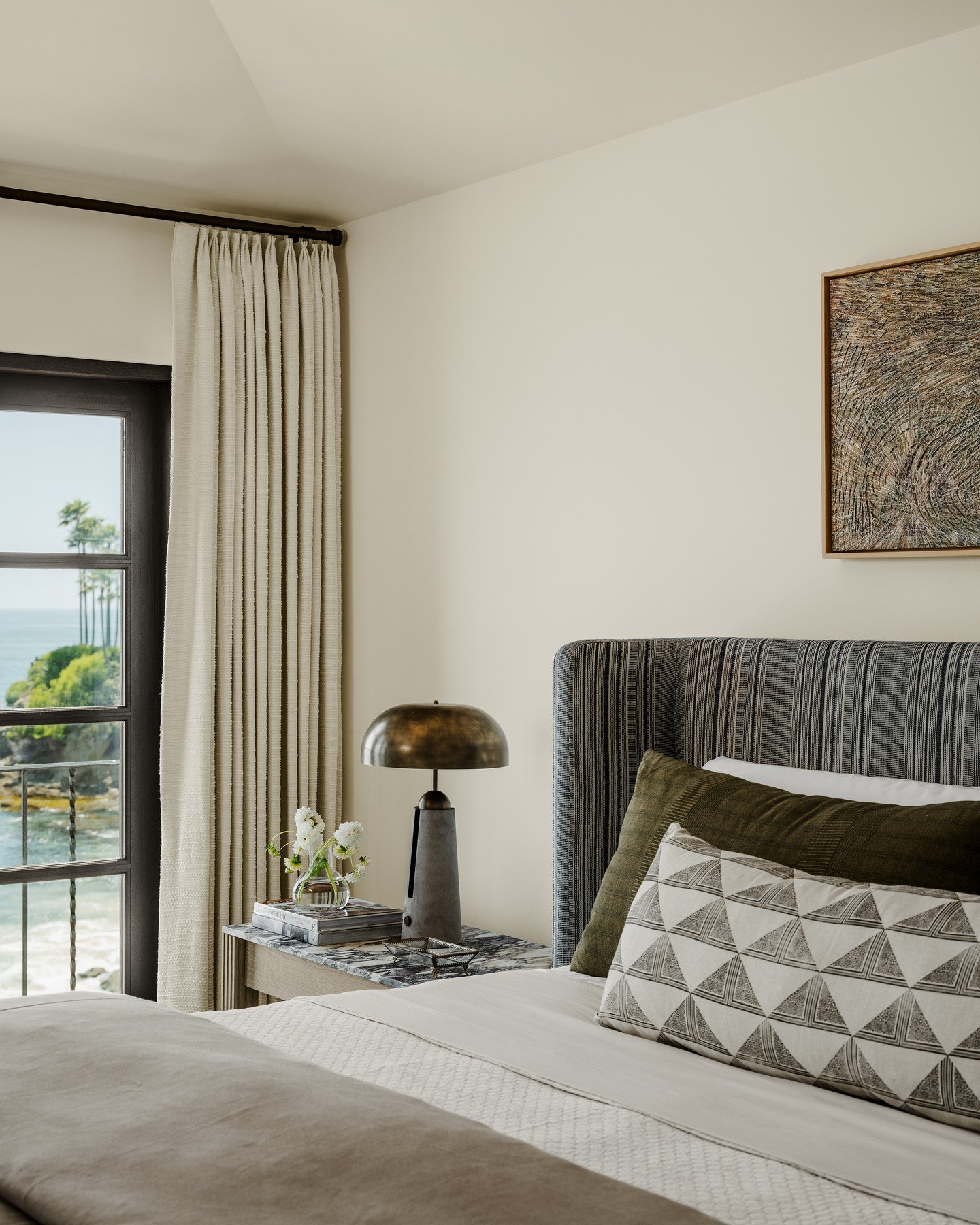 Nestled on a legendary property once owned by a prominent Hollywood actress, this oceanfront residence is infused with exquisite design elements that reflect its illustrious history. Skillfully updated, it celebrates its history while embracing conte