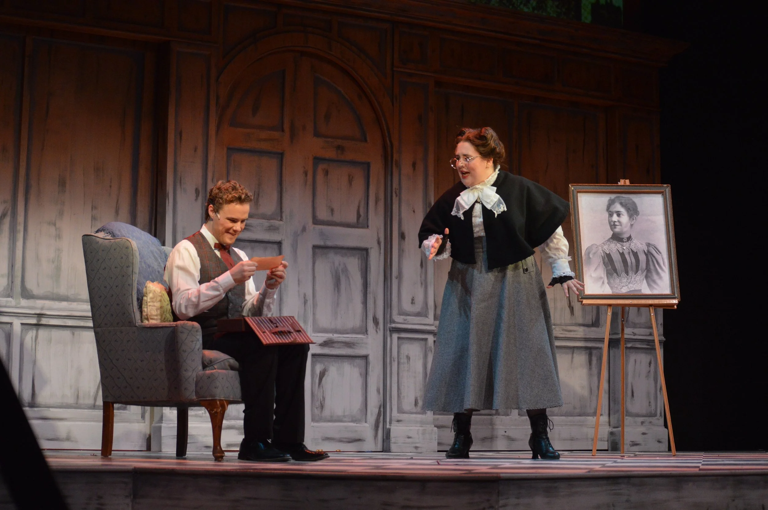 Set Dressing- 
Armchair: Pillows, Lace blanket
Props-
Easel: Double sided frame picture of Mother/Family Tree
Letter box: Letters and Paper Props
Board Pointer