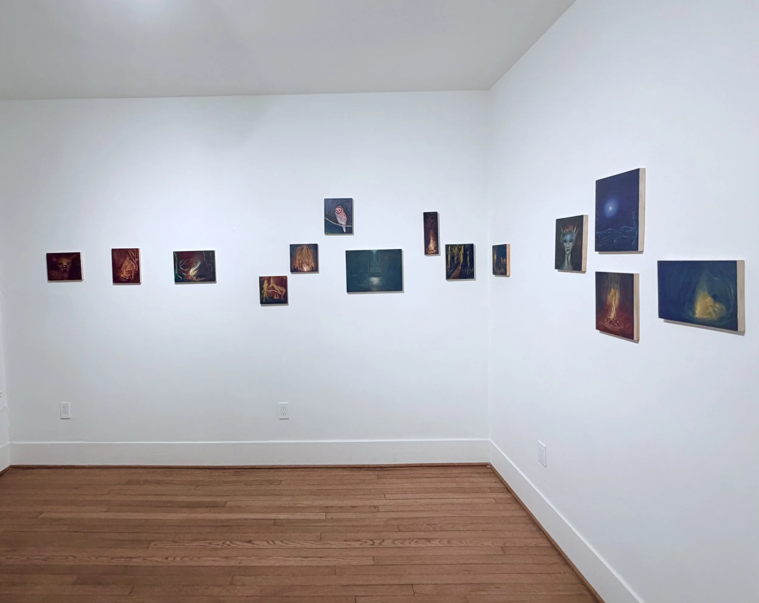 image of white gallery walls with work.