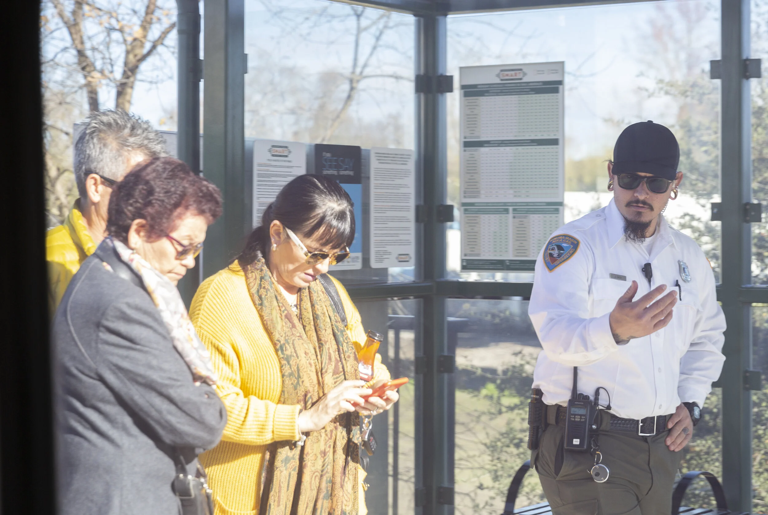 Conductor Joseph Torrigino-Baca, explains to passengers how to use the SMART app on their phone on Sunday, Jan. 5, 2020, in Santa Rosa, CA. (Photo: Genesis Botello)
