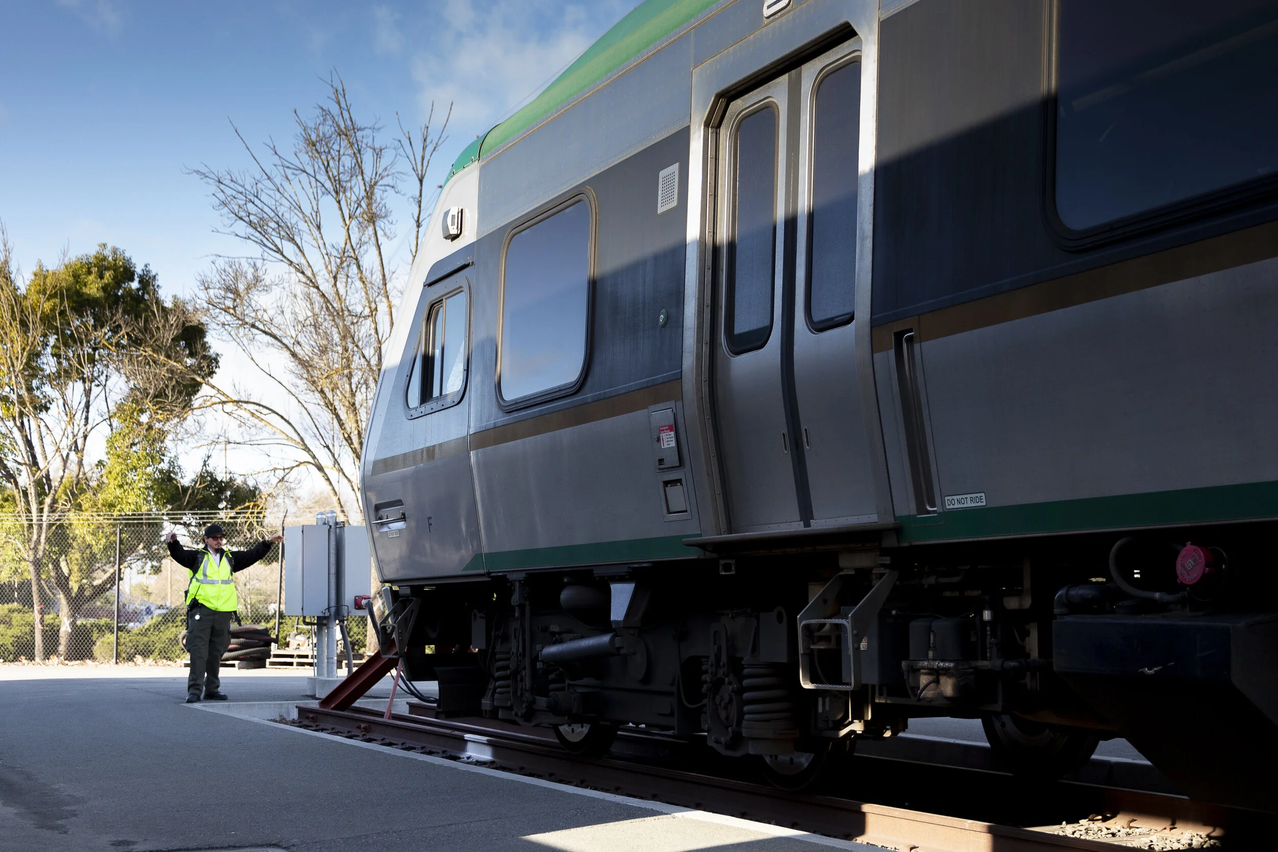 Joseph Torrigino-Baca hand signals to aid in parking the train on Sunday, Jan. 5, 2020, in Santa Rosa, CA. (Photo: Genesis Botello)