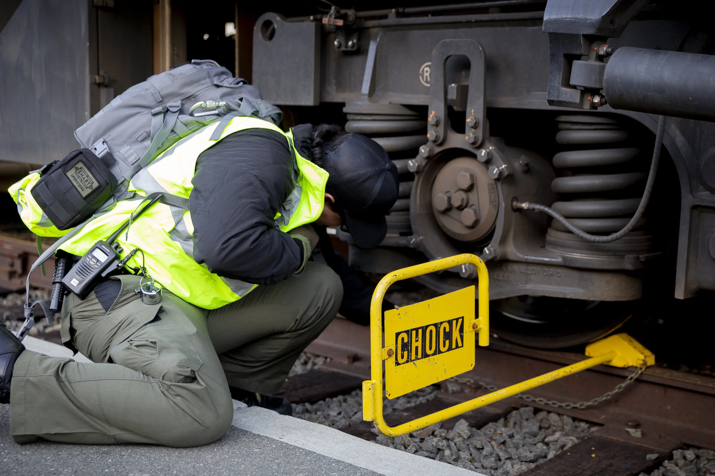 Joseph Torrigino-Baca applies a chock on the train wheel on Sunday, Jan. 5, 2020, in Santa Rosa, CA. (Photo: Genesis Botello)